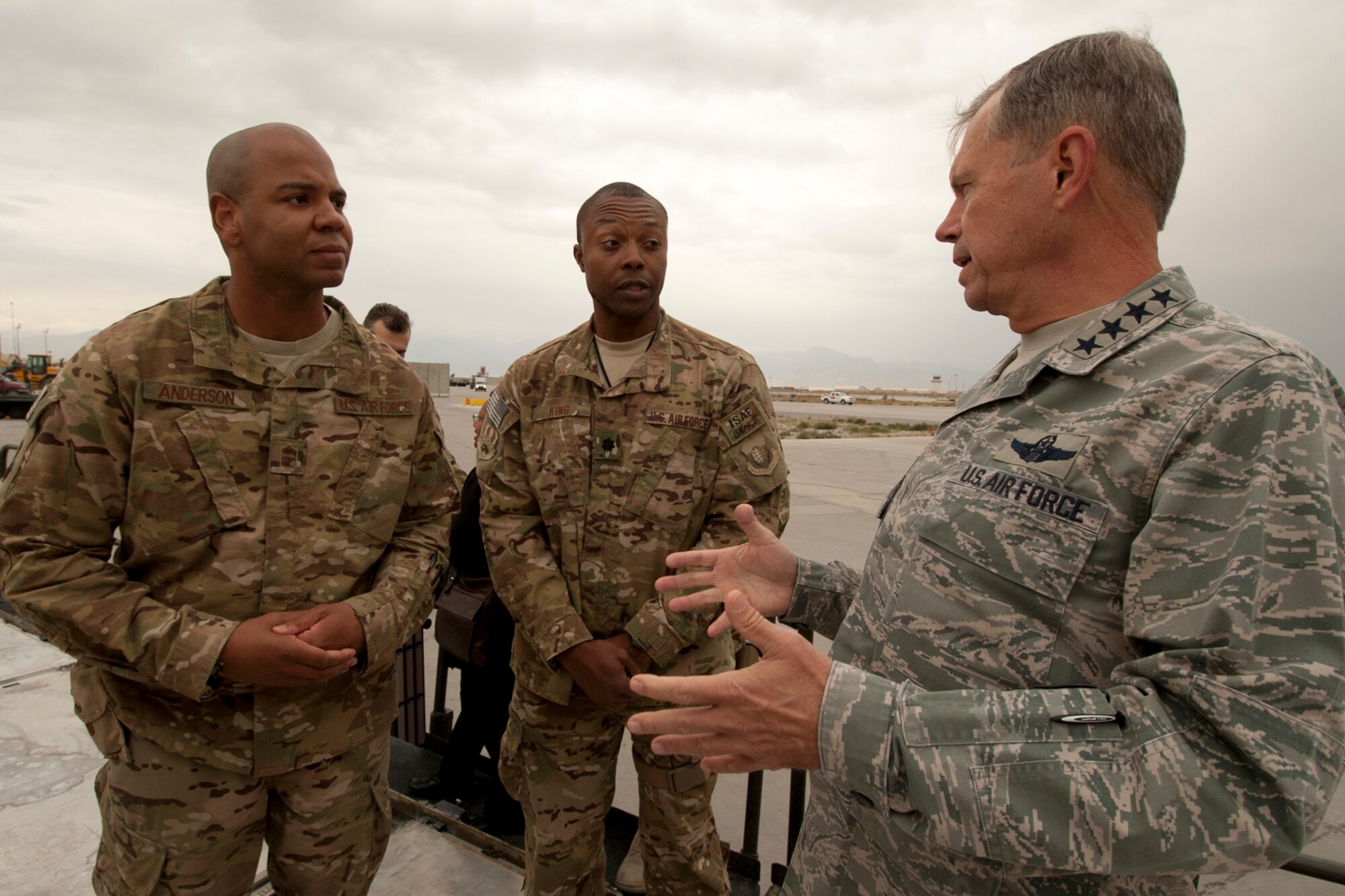 SMSgt Kenneth Anderson (left), 455th Expeditionary Aerial Port Squadron Operations superintendent and Lt. Col. Luther King, 455 EAPS commander (center), talk about the capabilities of the Aerial Port in moving thousands of tactical vehicles, pallets and passengers with Gen. William Fraser III, U.S. Transportation Command commander, during Fraser’s visit to Bagram Airfield, Afghanistan, Oct. 19, 2012. The general met with leadership from the 455 EAPS and the U.S. Army 401st Army Field Support Brigade to discuss plans of returning U.S. military equipment to the U.S. (U.S. Air Force photo/SSgt Jeff Nevison)