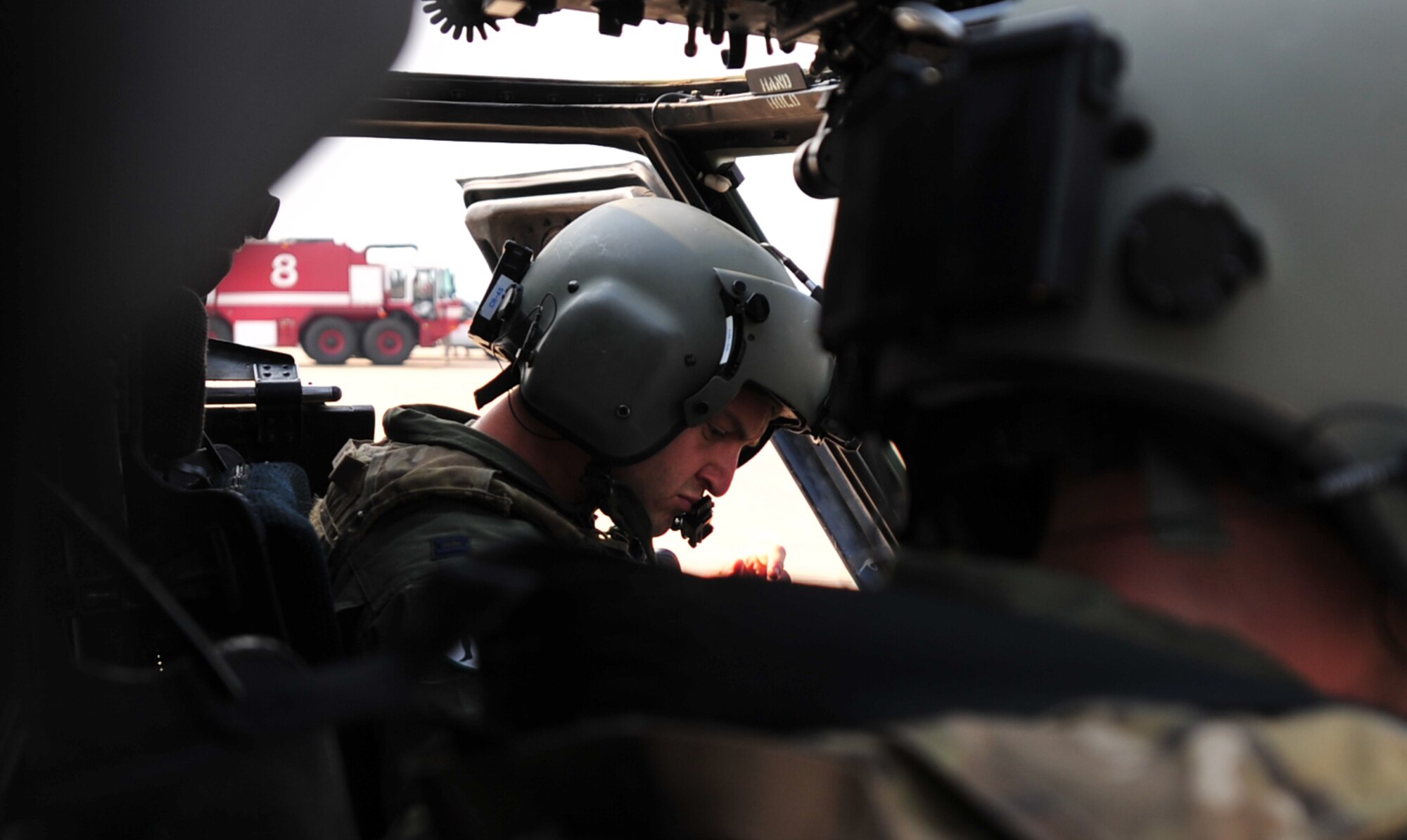 Capt. Mark Cerni, an HH-60 Pave Hawk pilot with the 33rd Rescue Squadron, prepares to fly during Osan Air Base's Air Power Day, Oct. 20, 2012. The Airmen participated in the air show to help highlight the relationship between them and the Koreans through public demonstrations of military equipment and personnel. (U.S. Air Force photo/Staff Sgt. Sara Csurilla)