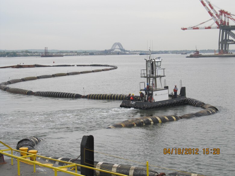 Dredged sand was used to cap or close the Newark Bay CDF. This photo shows the floating pipeline that connected the dredge to the pump barge at the CDF site.