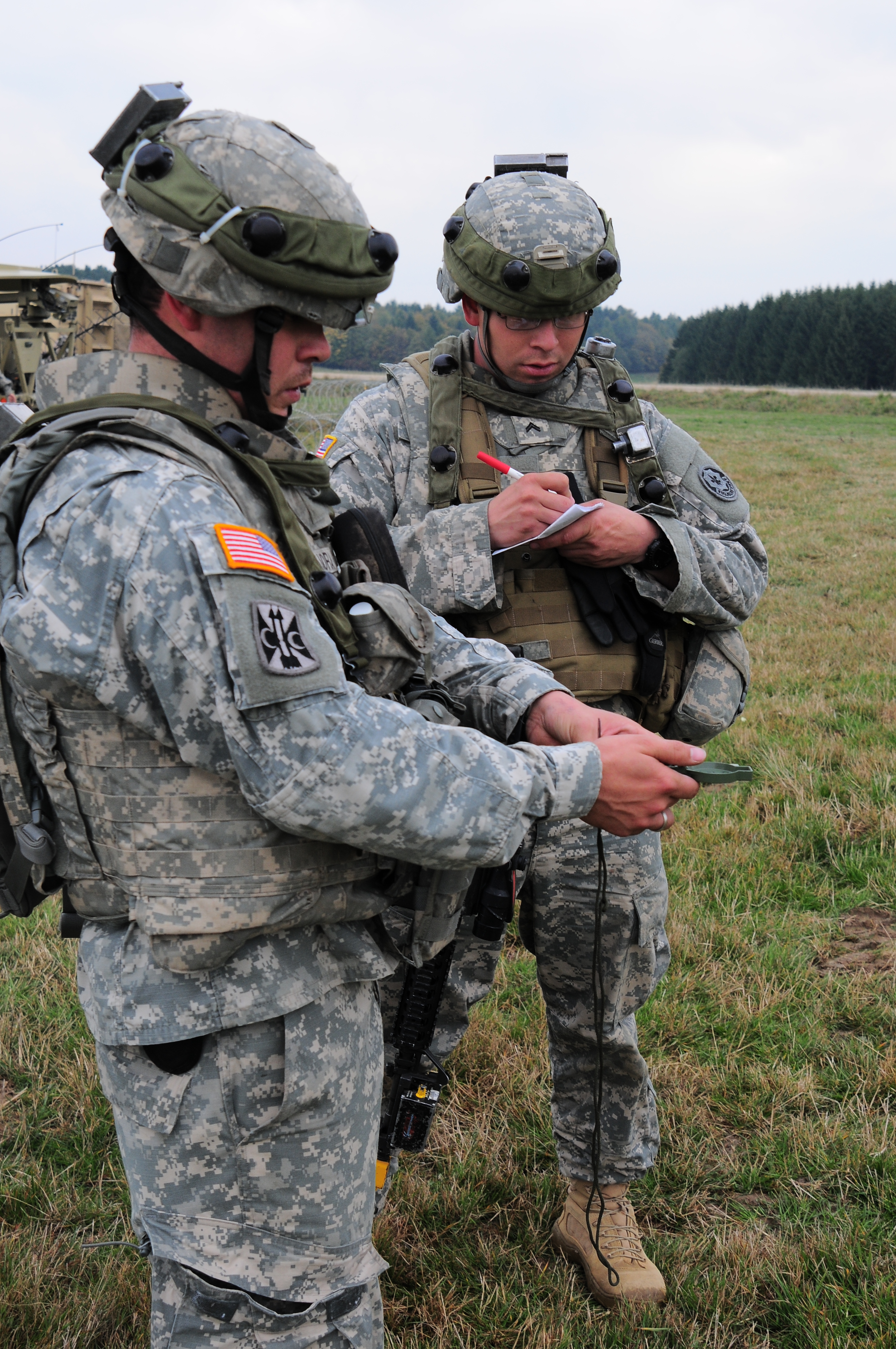 U.S. Army Warrant Officer David Zamora, left, and U.S. Army Cpl. Edward