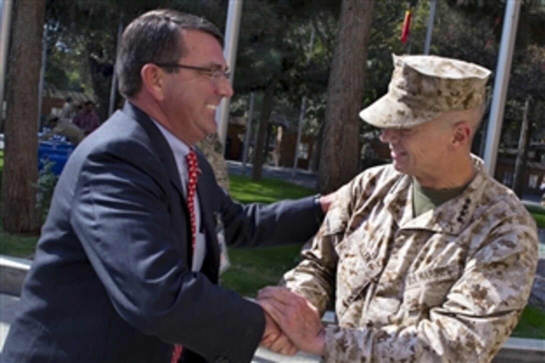 U.S. Marine Corps Gen. John R. Allen, commander, International Security Assistance Force, right, greets U.S. Deputy Defense Secretary Ashton B. Carter in, Kabul, Afghanistan, Oct. 21, 2012. Carter is on a seven-day trip to the Middle East. Allen has been nominated to serve as NATO’s supreme allied commander for Europe and commander of U.S. European Command.