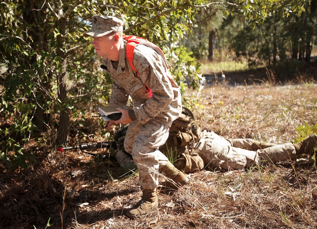 Sergeant Brodey Vann, an instructor with Special Operations Trainging Group, II Marine Expeditionary Force, coaches Marines with Company K, Battalion Landing Team 3rd Battalion, 2nd Marine Regiment, 26th Marine Expeditionary Unit, during a mechanized raid exercise aboard Marine Corps Base Camp Lejeune, N.C., Oct. 16. Marines with Special Operations Training Group, II Marine Expeditionary Force, trained the Marines of the 26th MEU in mechanized raid operations for two weeks in October.