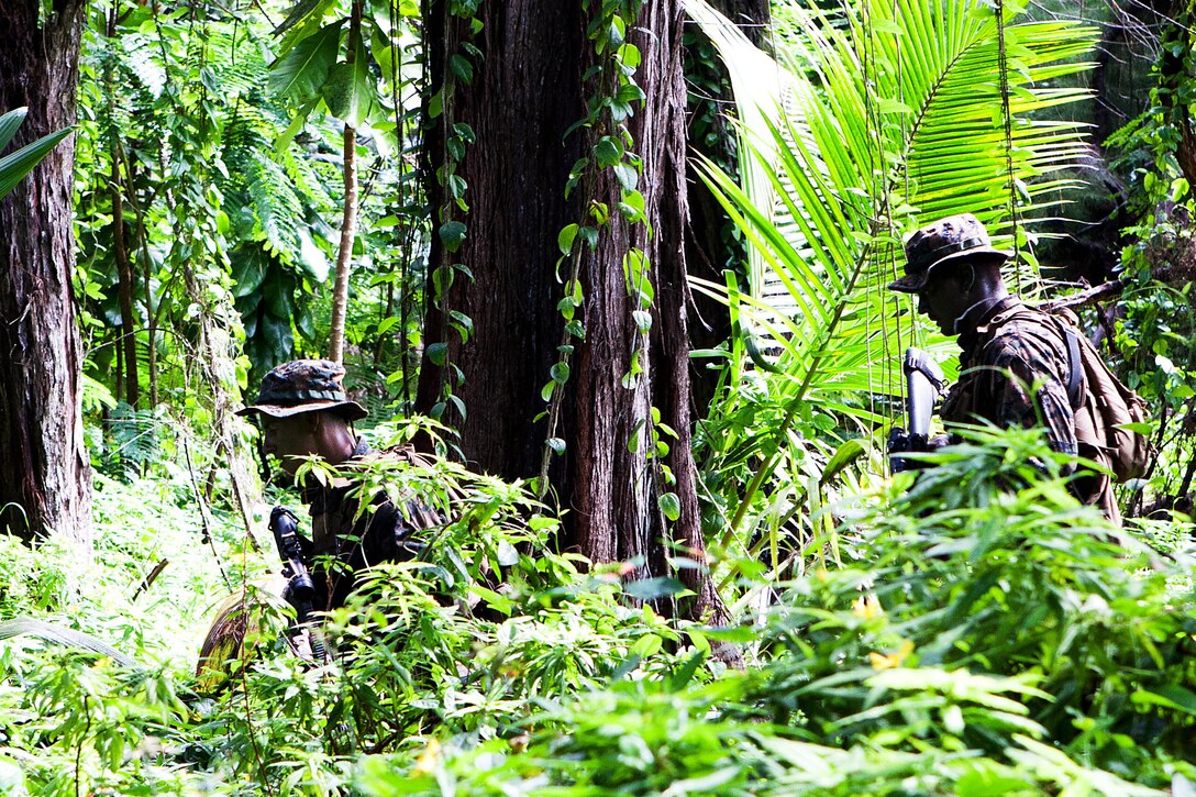 U.S. Marines make their way to their objective during a raid here Oct. 16 as part of Exercise Coconut Grove 2012. The exercise is a bilateral training event conducted bi-annually between the U.S. Marine Corps and the Maldivian National Defense Force. 