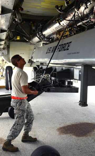 ANDERSEN AIR FORCE BASE, Guam— Airman 1st Class Anthony Rodriguez, 36th Expeditionary Aircraft Maintenance Squadron weapons load technician, deployed from the 96th Expeditionary Aircraft Maintenance Unit, Barksdale Air Force Base, La., ensures a training AGM-86C Conventional Air-Launched Cruise Missile is tightly connected to the Common Strategic Rotary Launcher on a B-52 Stratofortress during a load demonstration here, Oct. 17. Each EAMU deployed to Andersen has to pass a load inspection within 10 days of arrival as part of a U.S. Pacific Command requirement. (U.S. Air Force photo by Senior Airman Benjamin Wiseman/Released)