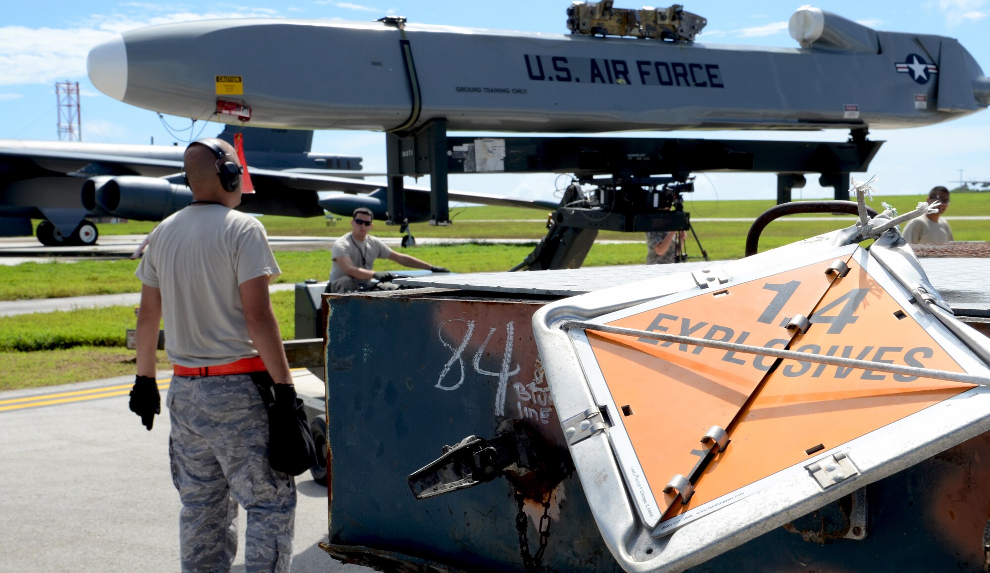 ANDERSEN AIR FORCE BASE, Guam— Members of the 36th Expeditionary Aircraft Maintenance Squadron, deployed from the 96th Expeditionary Aircraft Maintenance Unit, Barksdale Air Force Base, La., transport a training AGM-86C Conventional Air-Launched Cruise Missile to a waiting B-52 Stratofortress as part of a load demonstration here, Oct. 17. Each EAMU deployed to Andersen has to pass a load inspection within 10 days of arrival as part of a U.S. Pacific Command requirement. (U.S. Air Force photo by Senior Airman Benjamin Wiseman/Released)