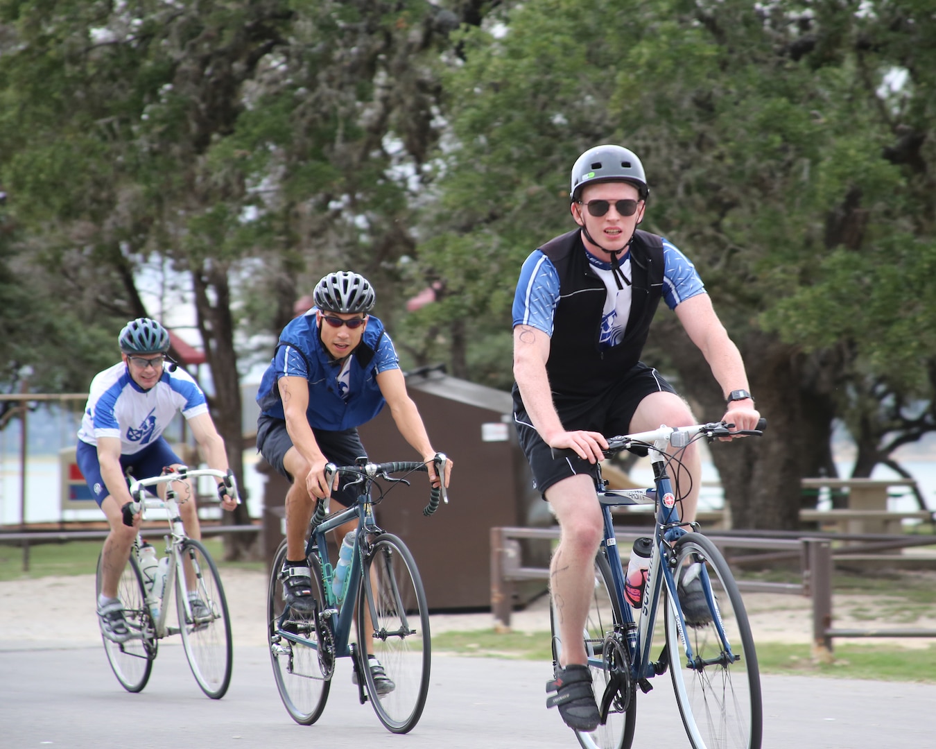 (From left to right)  Charles Shumaker, Brian Chung and Brian Peterson of the Phantom Knights Extreme Team, round a turn on the 22–mile bike course during the Rambler 120-team competition Oct. 20 held at Joint Base San Antonio Recreation Park, Canyon Lake, Texas.  The seventh annual Rambler 120 includes the bike course, a 6-mile run and a 2-mile rafting course. (U.S. Air Force photo by Dan J. Solis)