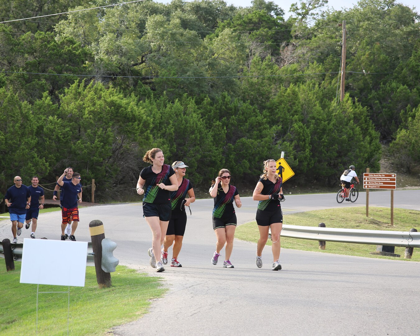 (From left to right)  Kristin Cross, Astrid Wisser, Rachel Wood and Christi Menges, members of the Sweaty Swappers team begin the 6-mile run portion of the Rambler 120 triathlon event at Canyon Lake, Texas, Oct. 20.  The team captured the Silver – All Female Relay category in the competition with a time of 3:50:46 (U.S. Air Force photo by Dan J. Solis)