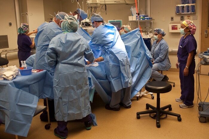 Airmen and Veterans Affairs perioperative nurses and surgical technologists, 99th Surgical Operations Squadron, begin a surgical procedure at the Mike O' Callaghan Federal Medical Center Oct. 22, 2012, at Nellis Air Force Base, Nev. The OR consists of seven surgical suites with specialties ranging from vascular, orthopedics, plastics, podiatry, urology, and ophthalmology. (U.S. Air Force photo by Staff Sgt. Christopher Hubenthal)