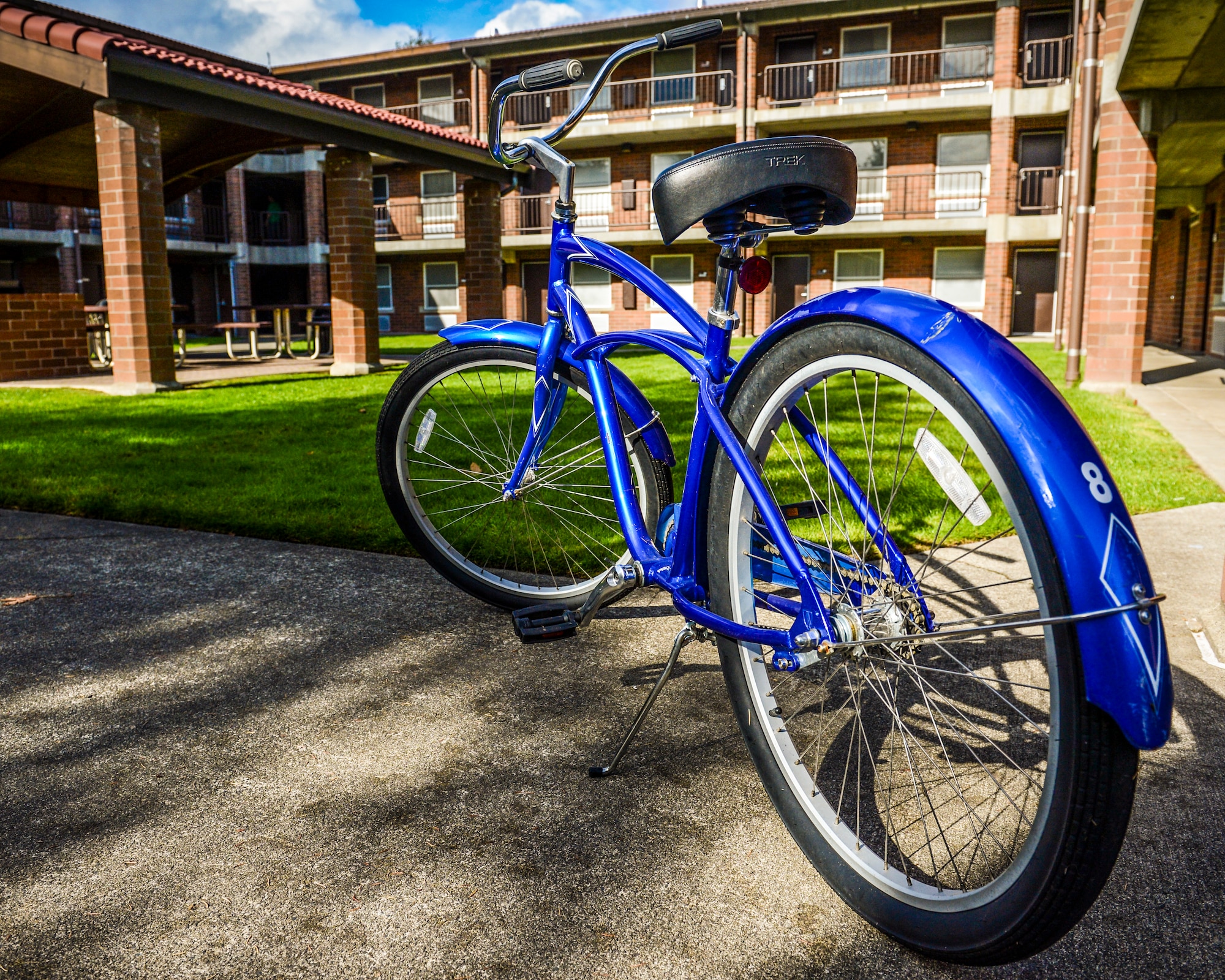 A bicycle is parked in the courtyard of one of the McChord Field dormitories, Oct 23, 2012, at Joint Base Lewis-McChord, Wash. The bicycle is part of the McChord Field bike share program created to help Airmen who do not have vehicles travel around base. (U.S. Air Force photo/Staff Sgt. Sean Tobin)