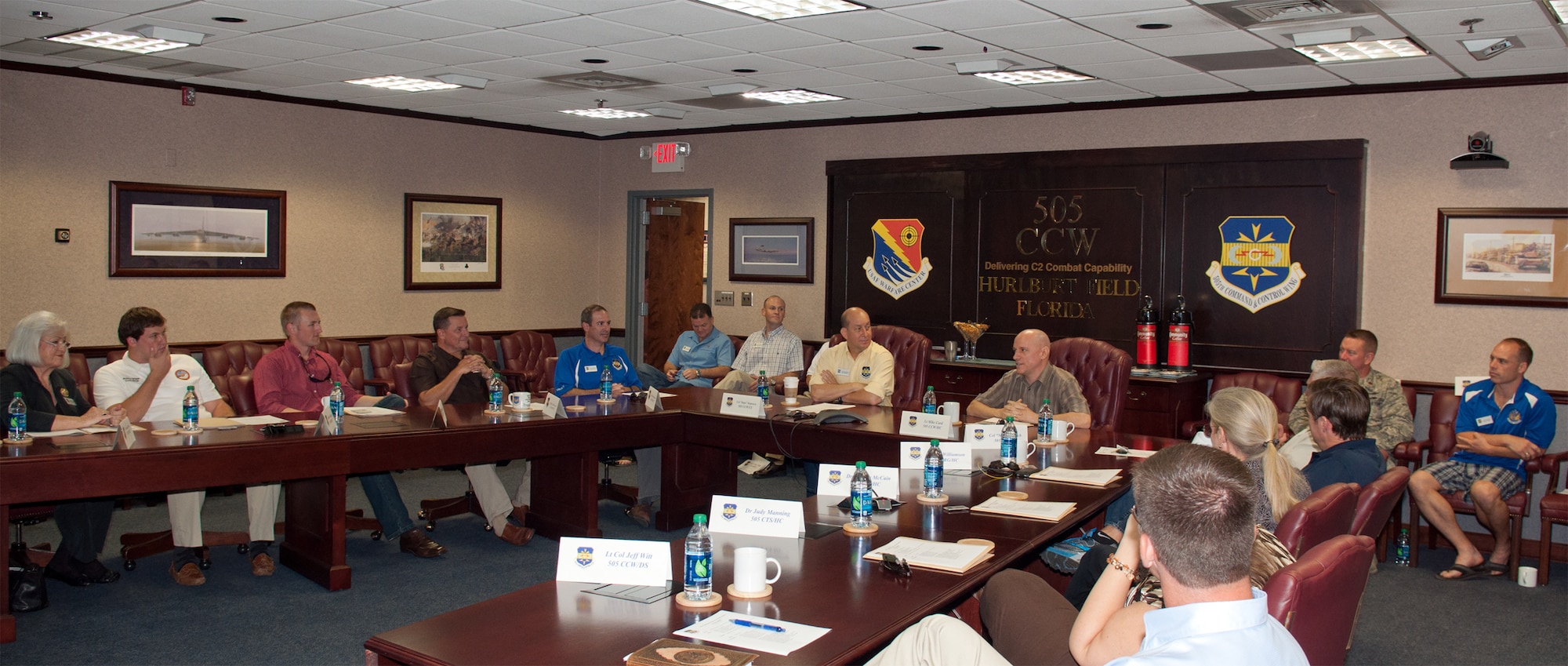 Col. Mustafa Koprucu, commander of 505th Command and Control Wing (yellow shirt), welcomes the wing's new honorary commanders at wing headquarters in Hurlburt Field, Fla., Oct. 13, 2012. The annual Honorary Commanders Program is intended to build and maintain solid, mutually beneficial relationships between the wing and surrounding communities. (Courtesy photo)