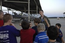 1st Lt. Taylor Tally, 55th Fighter Squadron F-16 Fighting Falcon wingman and scheduler, tells Cub Scout Pack 320 about being a pilot in an F-16 during a tour of the flight line at Shaw Air Force Base, S.C., Oct. 16, 2012. Cub Scouts are boys in between the ages seven and 10 years old or are in 1st through 5th grade. Boy between 11 to 17 years old can join Boy Scouts.(U.S. Air Force photo by Airman 1st Class Krystal M. Jeffers/Released)
