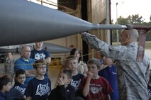 Master Sgt. Emil Wodika, 20th Component Maintenance Squadron resource advisor and cub master of Cub Scout Pack 320, informs members of Pack 320 about the F-16 Fighting Falcon during a tour of the flight line at Shaw Air Force Base, S.C., Oct. 16, 2012. Cub Scouts are open to any boy in 1st grade through 5th grade or are seven to 10 years old. (U.S. Air Force photo by Airman 1st Class Krystal M. Jeffers/Released)