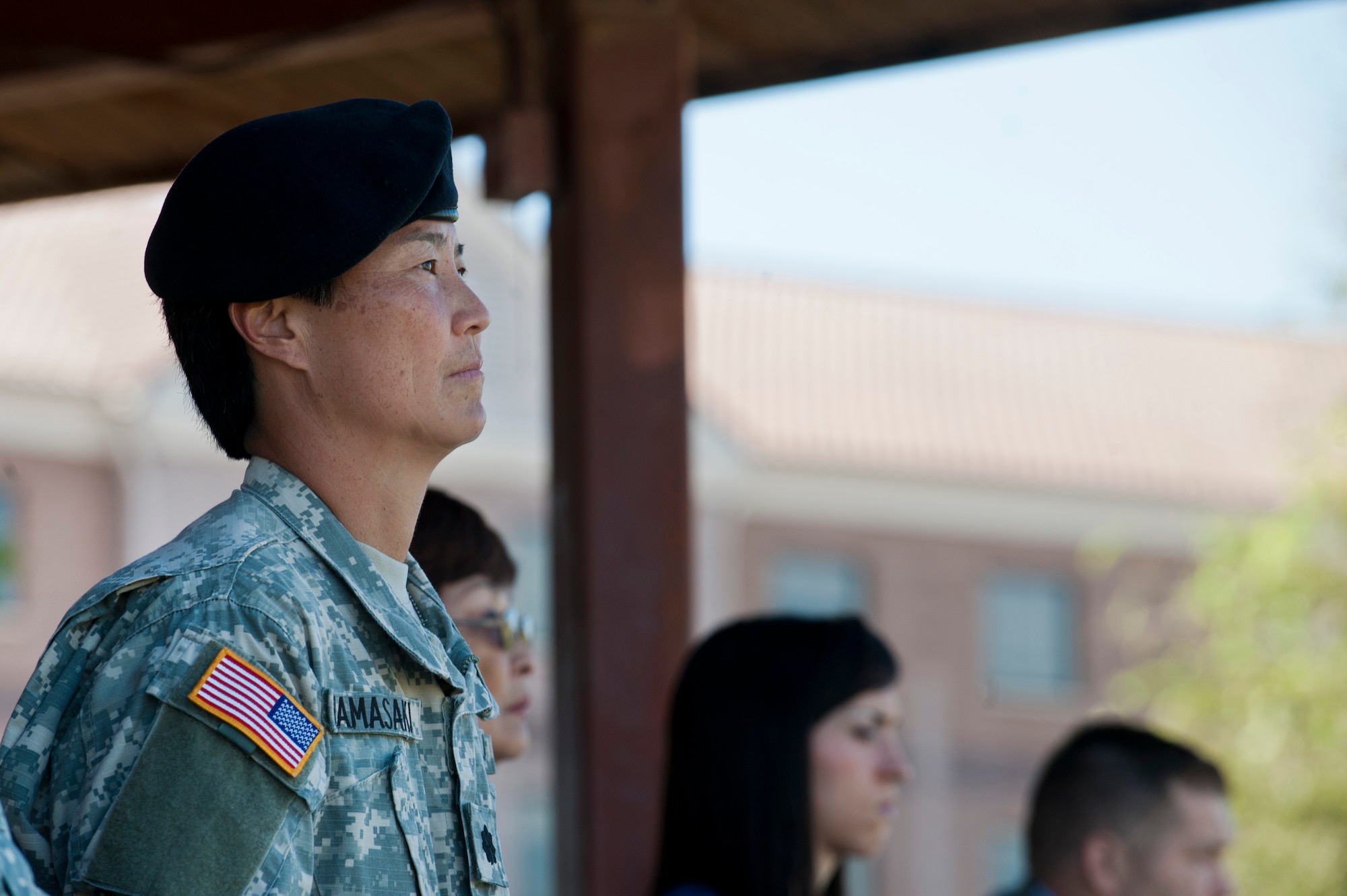 Lt. Col. Robyn Hamasaki, 63rd Brigade Support Battalion commander, listens to a speech given by Col. Richard Lamb, 311th Sustainment Command commander, during an activation ceremony for the 63rd Brigade Support Battalion Oct. 21, 2012, at Nellis Air Force Base, Nev. The 63rd BSB is located in southern Las Vegas and chose Nellis AFB as the location of their ceremony due to its close proximity.  (U.S. Air Force photo by Airman 1st Class Jason Couillard)