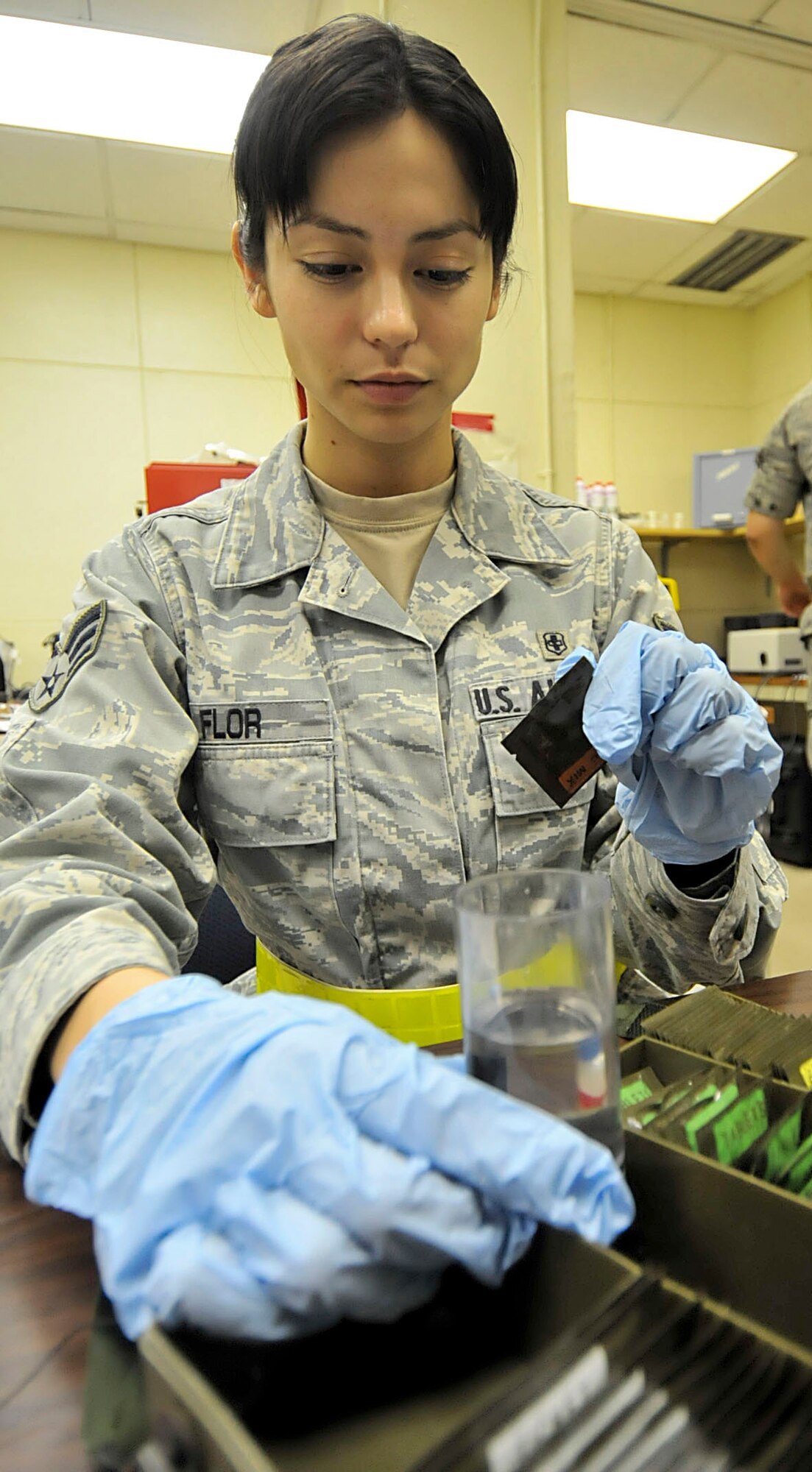 U.S. Air Force Senior Airmen Jovanna Flor, 18th Aerospace Medicine Squadron bioenvironmental engineering technician, prepares to add zinc mix from the M272 kit to test water for chemical warfare agents during the third day of a Pacific Air Forces readiness inspection on Kadena Air Base, Japan, Oct. 24, 2012. The M272 kit contains water testing materials to determine if water has been contaminated. These Airmen keep their equipment ready at all times in case they are called to respond to a scenario. (U.S. Air Force photo/Staff Sgt. Darnell T. Cannady)