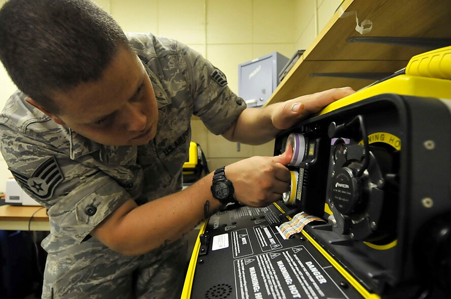 U.S. Air Force Staff Sgt. Brandon Kama'i, 18th Aerospace Medicine Squadron bioenvironmental engineering technician, loads carrier and internal standard gases into the hapsite as part of equipment preparation during the third day of a Pacific Air Forces readiness inspection on Kadena Air Base, Japan, Oct. 24, 2012. The hapsite is used to identify contaminates and measures the volatile organic compounds in the air. These Airmen keep their equipment ready at all times in case they are called to respond to a scenario. (U.S. Air Force photo/Staff Sgt. Darnell T. Cannady)