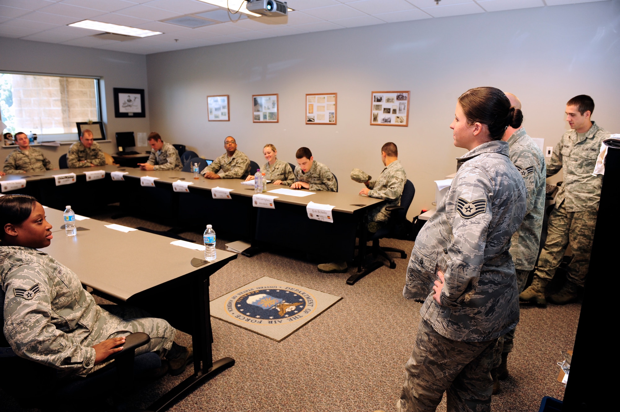Staff Sgt. Shelby Bird, 20th Force Support Squadron Airman Leadership School instructor, briefs her class before beginning the public speaking portion of the course at Shaw Air Force Base, S.C., Oct. 22, 2012. Students are allotted a certain amount of time to speak during this portion of the course and are graded and critiqued at the end of their briefing. (U.S. Air Force photo by Airman 1st Class Daniel Blackwell/Released)