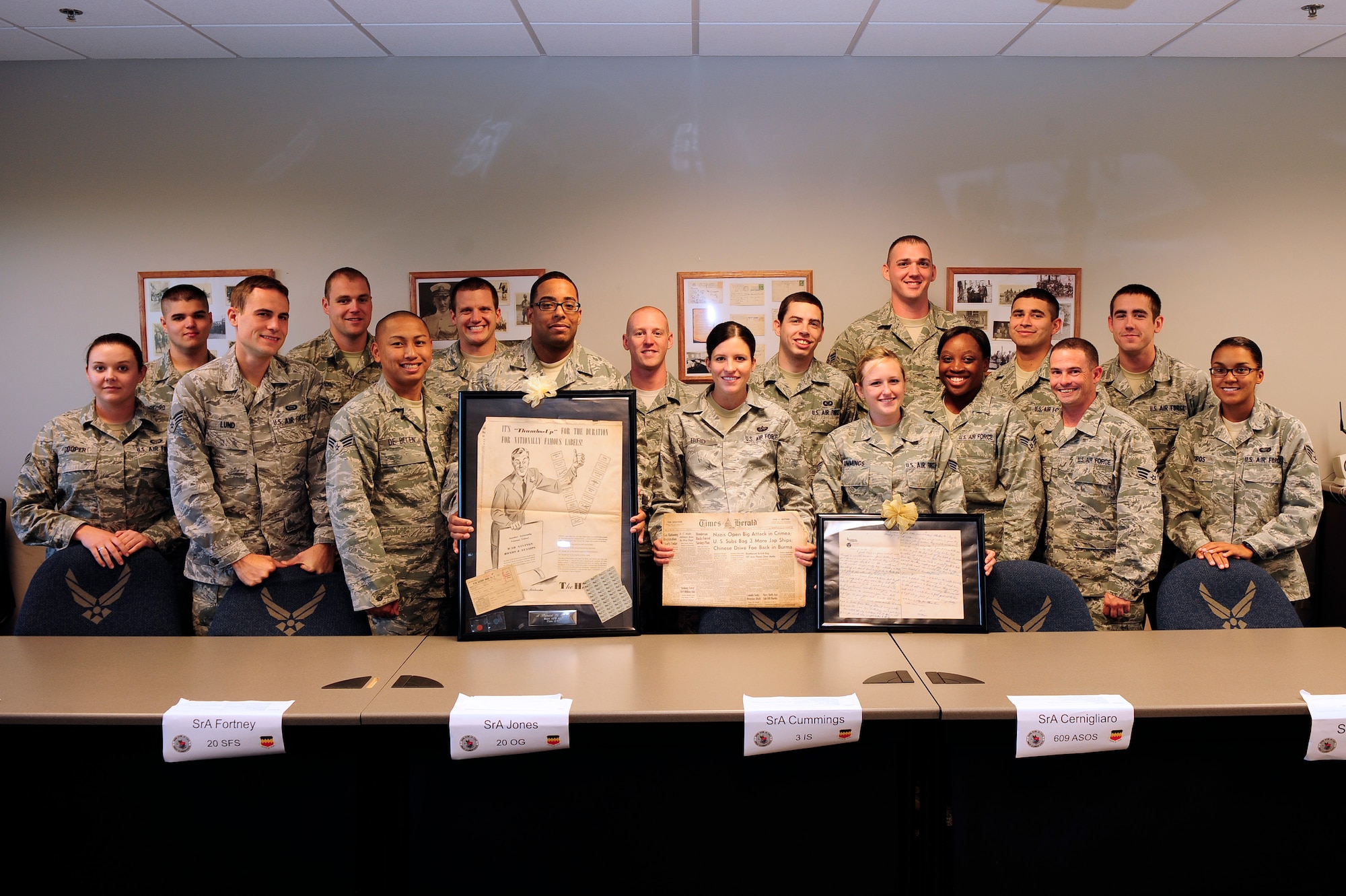 Staff Sgt. Shelby Bird, 20th Force Support Squadron Airman Leadership School instructor, stands with her class after being presented with vintage collectors memorabilia at Shaw Air Force Base, S.C., Oct. 22, 2012. Some of the items displayed date back to the 1940s. (U.S. Air Force photo by Airman 1st Class Daniel Blackwell/Released)