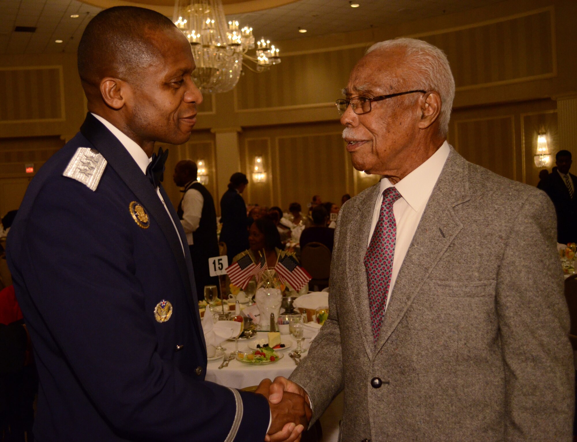 SCOTT AIR FORCE BASE, Ill. - Lt. Gen. Darren McDew, 18th Air Force commander, greets Christopher Newman, an orginal Tuskegee Airman, Oct. 21, 2012 during the East St. Louis NAACP Freedom Fund Banquet at the Millennium hotel in St. Louis, MO. (U.S. Air Force photo/Master Sgt. Kimberly Spinner)