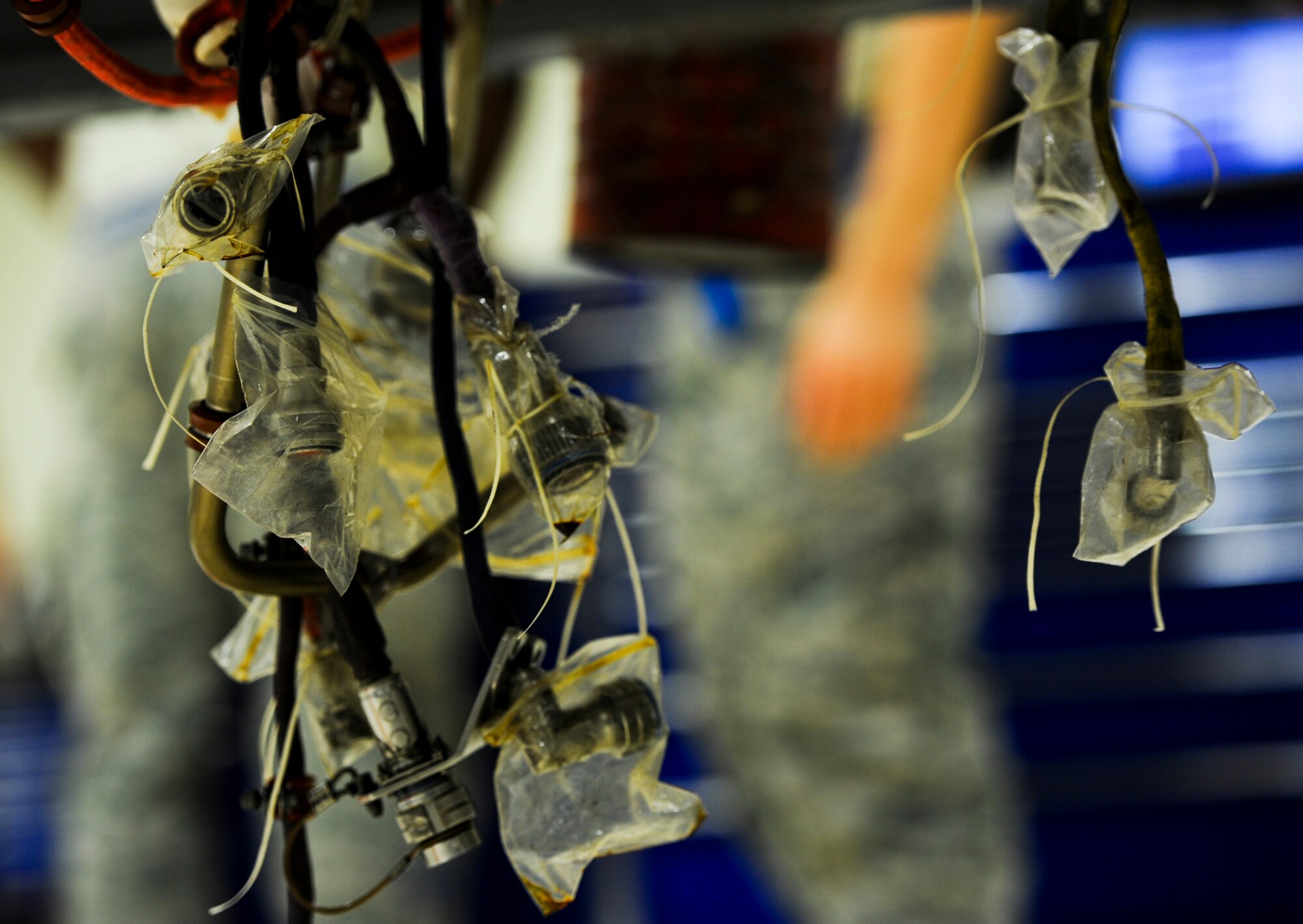 Electrical wires and fuel lines are covered and hung to keep out debris during Exercise Beverly Bearcat 12-1, an operational readiness inspection, on Kadena Air Base, Japan, Oct. 24, 2012. Readiness inspections are routinely conducted at bases Air Force wide to evaluate the ability of Air Force units to respond to a wide range of contingencies. (U.S. Air Force photo/Airman 1st Class Justin Veazie)