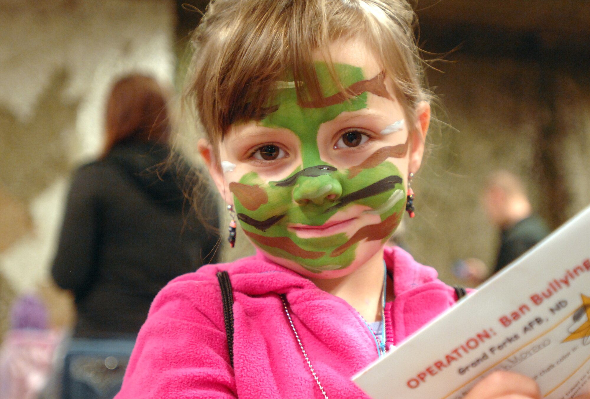 Leah Moreno, 5, processes through a Family Deployment Line on Grand Forks Air Force Base, N.D. on Oct. 20, 2012. Nearly 250 family members got a glimpse of life as a deployed Airman through the event, sponsored by the base Airman & Family Services Flight. The purpose of the event was to give families the opportunity to show children ages 3-16 a firsthand look at what Airmen experience when preparing for a deployment. (U.S. Air Force photo/Senior Airman Susan L. Davis)