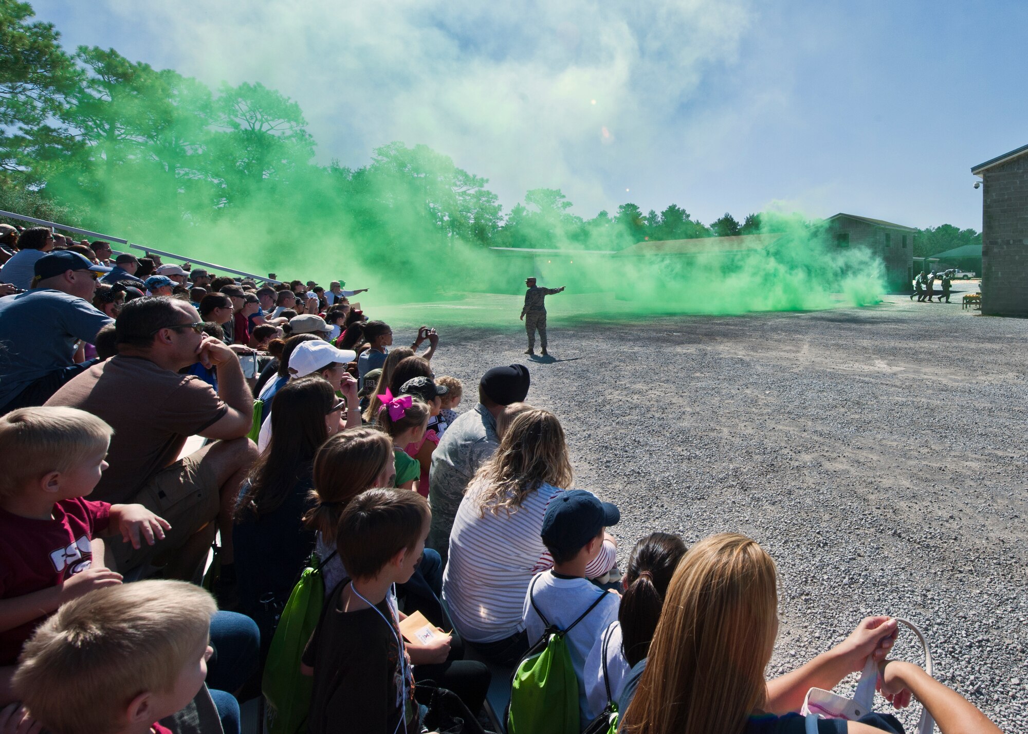 Master Sgt. Robert Shoemake, 96th Ground Combat Training Squadron, commentates on a demonstration performed by the 96 GCTS counter insurgence team during Operation Hero at Eglin Air Force Base, Fla., Oct. 20. The event, sponsored by the 96th Test Wing Airman and Family Readiness Center, teaches children the experiences their military family members go through during predeployment and while out in the field. (U.S. Air Force photo/Randy Gon)