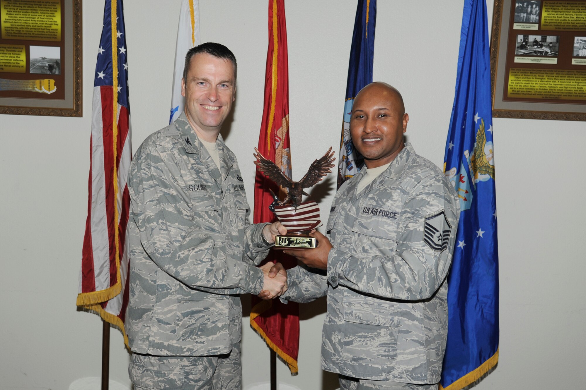 U.S. Air Force Col. Thomas Schmidt, 17th Training Wing (TRW) vice commander, presents the Team Goodfellow Senior Service Member of the Quarter to Master Sgt. Marvin Hawkins, 17th Medical Operations Squadron, during the wing quarterly awards ceremony, Goodfellow Air Force Base, Texas, Oct. 23, 2012. (U.S. Air Force photo by Staff Sgt. Austin Knox)