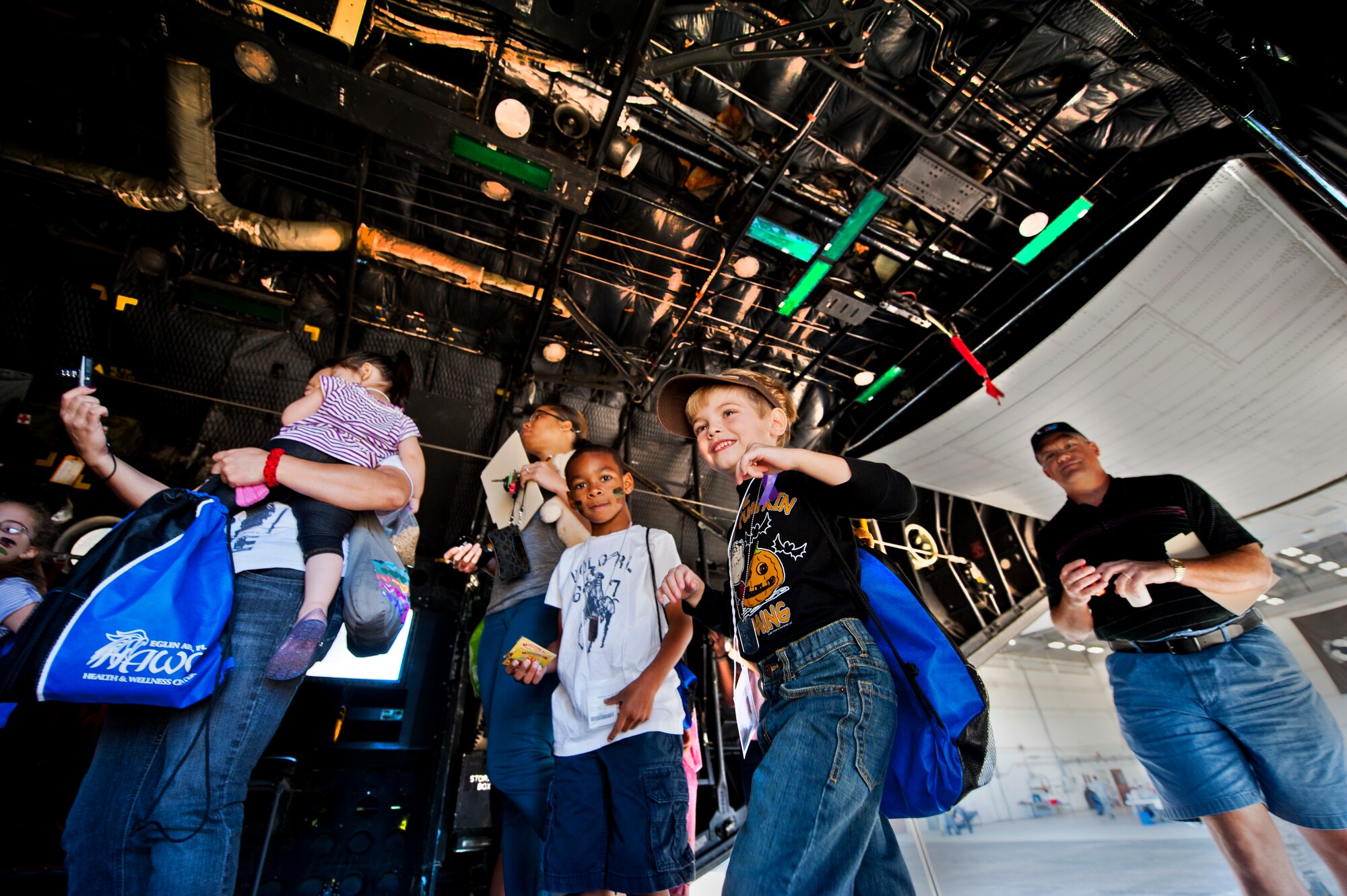Potential, future Airmen walk up the ramp of a static C-130 aircraft, during Operation Hero at Eglin Air Force Base, Fla., Oct. 20. The event, sponsored by the 96th Test Wing Airman and Family Readiness Center, teaches children the experiences their military family members go through during predeployment and while out in the field. (U.S. Air Force photo/Randy Gon)