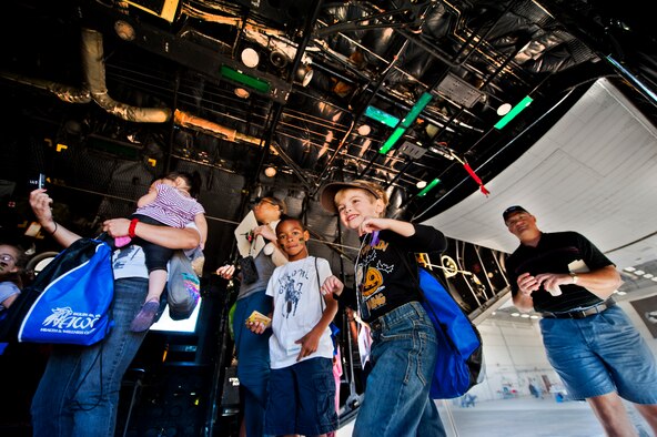 Potential, future Airmen walk up the ramp of a static C-130 aircraft, during Operation Hero at Eglin Air Force Base, Fla., Oct. 20. The event, sponsored by the 96th Test Wing Airman and Family Readiness Center, teaches children the experiences their military family members go through during predeployment and while out in the field. (U.S. Air Force photo/Randy Gon)