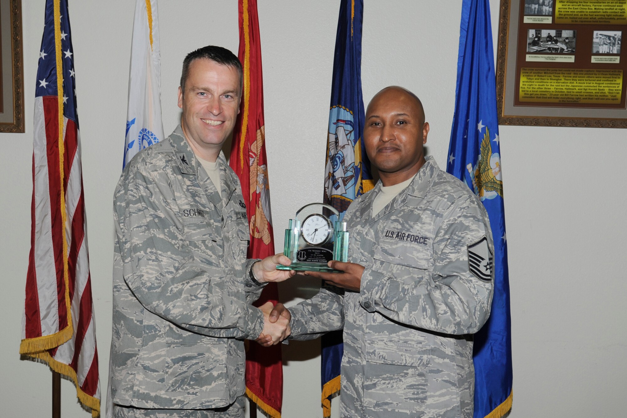 U.S. Air Force Col. Thomas Schmidt, 17th Training Wing (TRW) vice commander, presents the 17th Training Wing SNCO of the Quarter to Master Sgt. Marvin Hawkins, 17th Medical Operations Squadron, during the wing quarterly awards ceremony, Goodfellow Air Force Base, Texas, Oct. 23, 2012. (U.S. Air Force photo by Staff Sgt. Austin Knox)