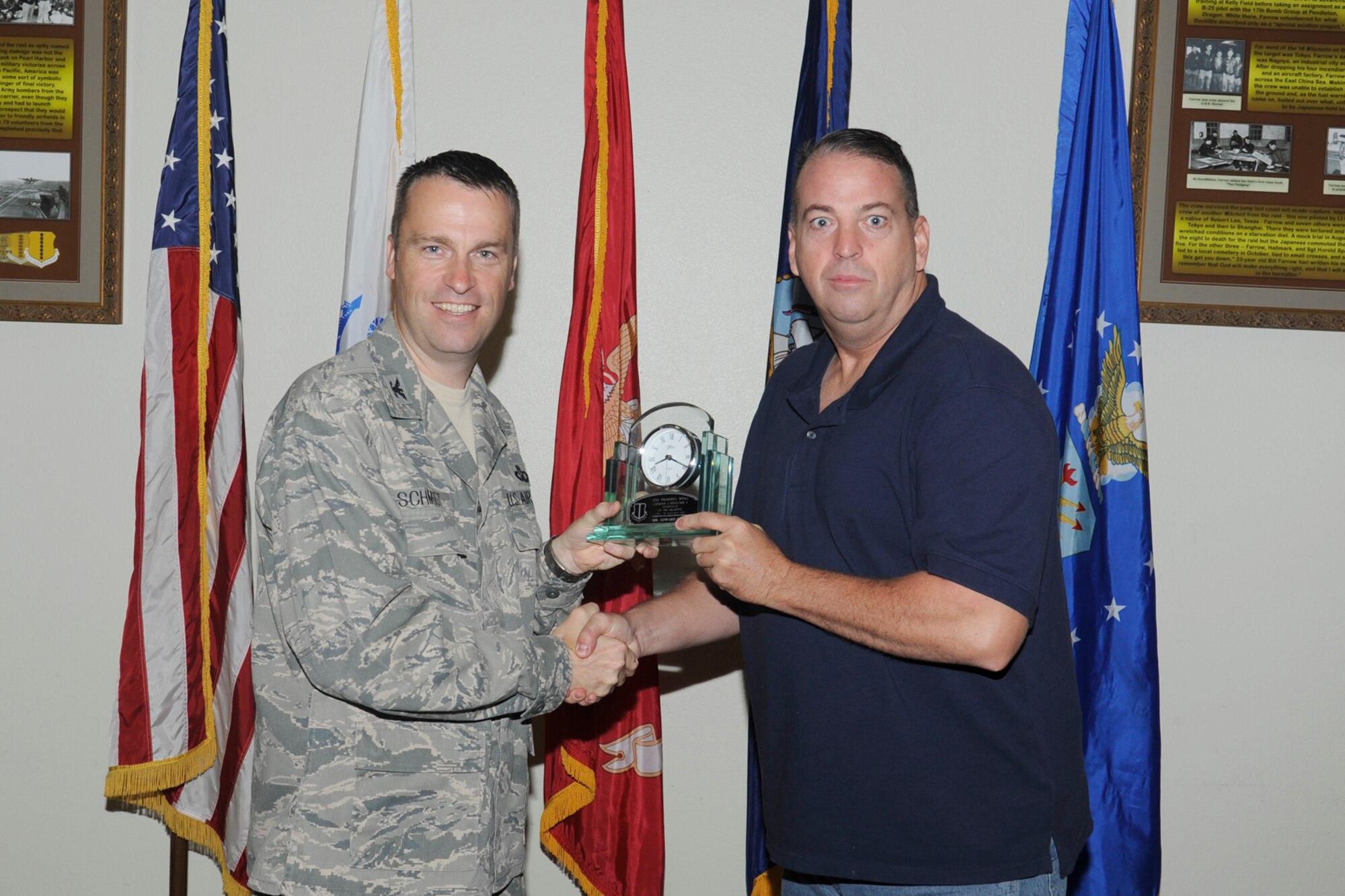 U.S. Air Force Col. Thomas Schmidt, 17th Training Wing (TRW) vice commander, presents the 17th Training Wing Civilian Supervisor of the Quarter Category I to Edward Ford, 17th Logistics Readiness Squadron, during the wing quarterly awards ceremony, Goodfellow Air Force Base, Texas, Oct. 23, 2012. (U.S. Air Force photo by Staff Sgt. Austin Knox)