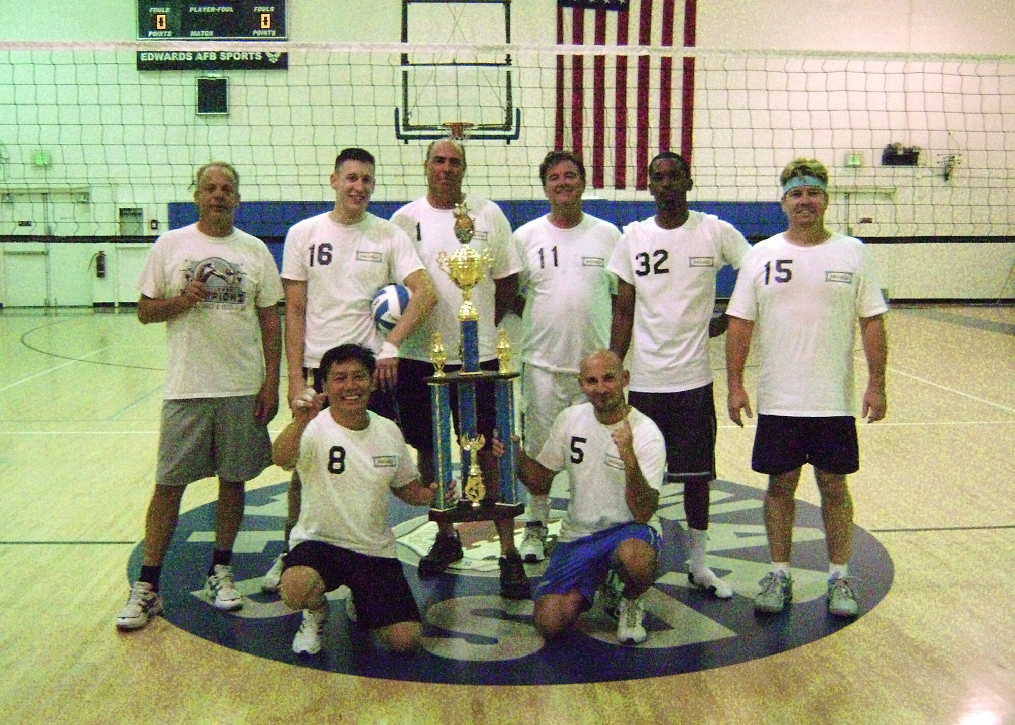 The 419th Flight Test Squadron celebrates after winning the 2012 Edwards Intramural Volleyball Championship game Oct. 18. The 419 FLTS volleyball team defeated the 412th Operations Group after playing three sets with a score of 23-25, 25-21 and 15-11 in order to win the championship. The intramural volleyball season will move back to its normal scheduled slot in 2013 with the season commencing early March. (U.S. Air Force photo by Steven Lowe)