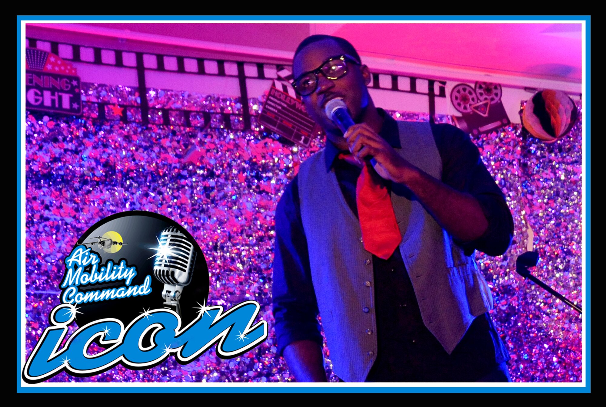 Airman 1st Class Andrew Hicks, an aerospace medical technician with the 319th Medical Operations Squadron, performs for judges and guests attending the AMC Icon (base-level) singing competition, Aug. 16, 2012, at the Northern Lights Club on Grand Forks Air Force Base, N.D. Hicks will represent Grand Forks AFB at the AMC Icon (major command-level) singing contest at Scott AFB, Ill., Oct. 25, 2012.  AMC Icon is loosely based on the popular TV show American Idol and features active duty Air Force vocalists from all 10 bases in the Air Mobility Command. (U.S. Air Force photo illustration/Senior Airman Luis Loza Gutierrez)