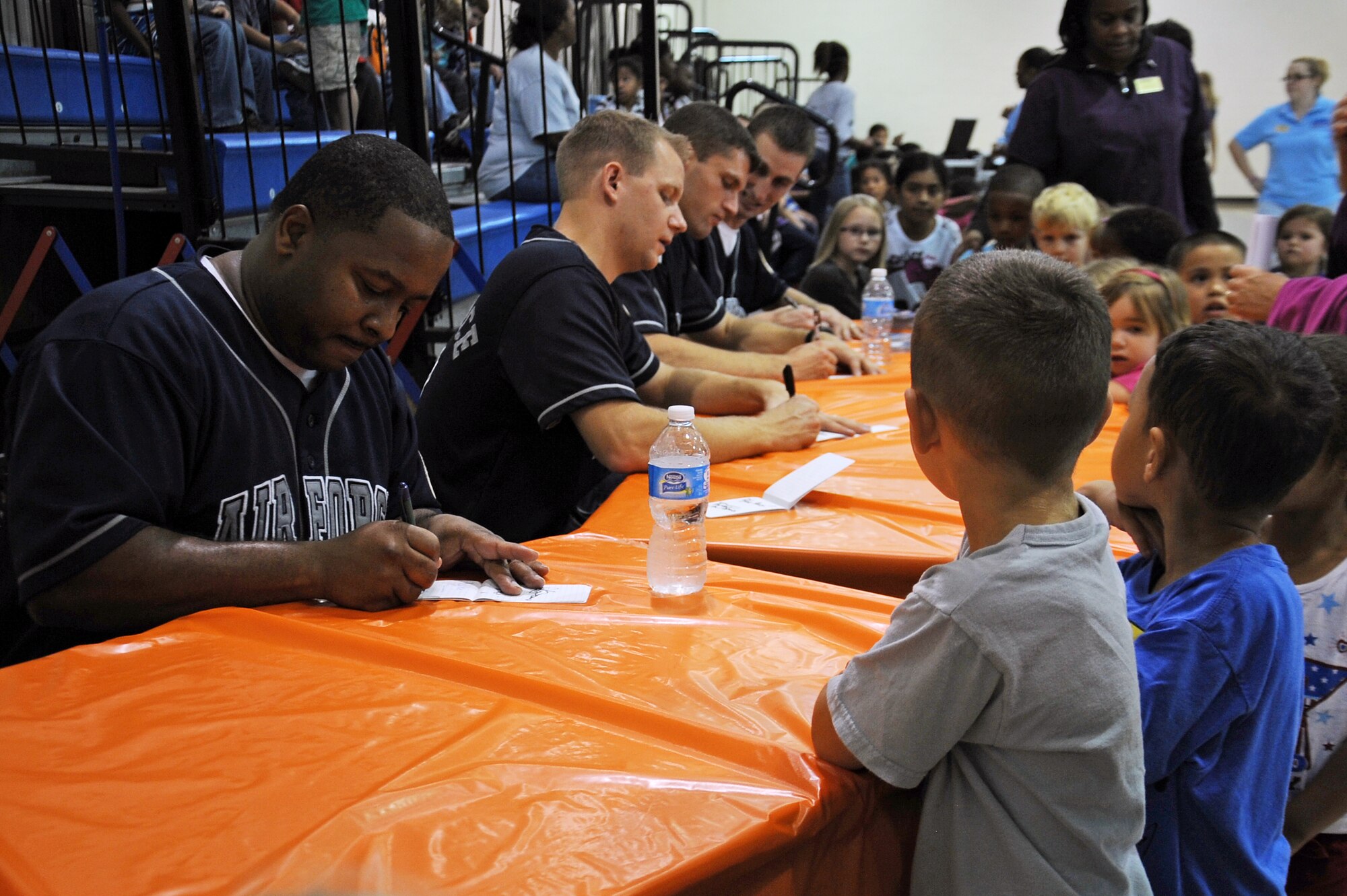 Blue Aces band members sign autographs for members of Team Seymour at the youth center on Seymour Johnson Air Force Base, N.C., Oct. 17, 2012. The band travels to numerous stateside and overseas bases performing for military members and their families to boost morale (U.S. Air Force photo/Airman 1st Class John Nieves Camacho/Released)