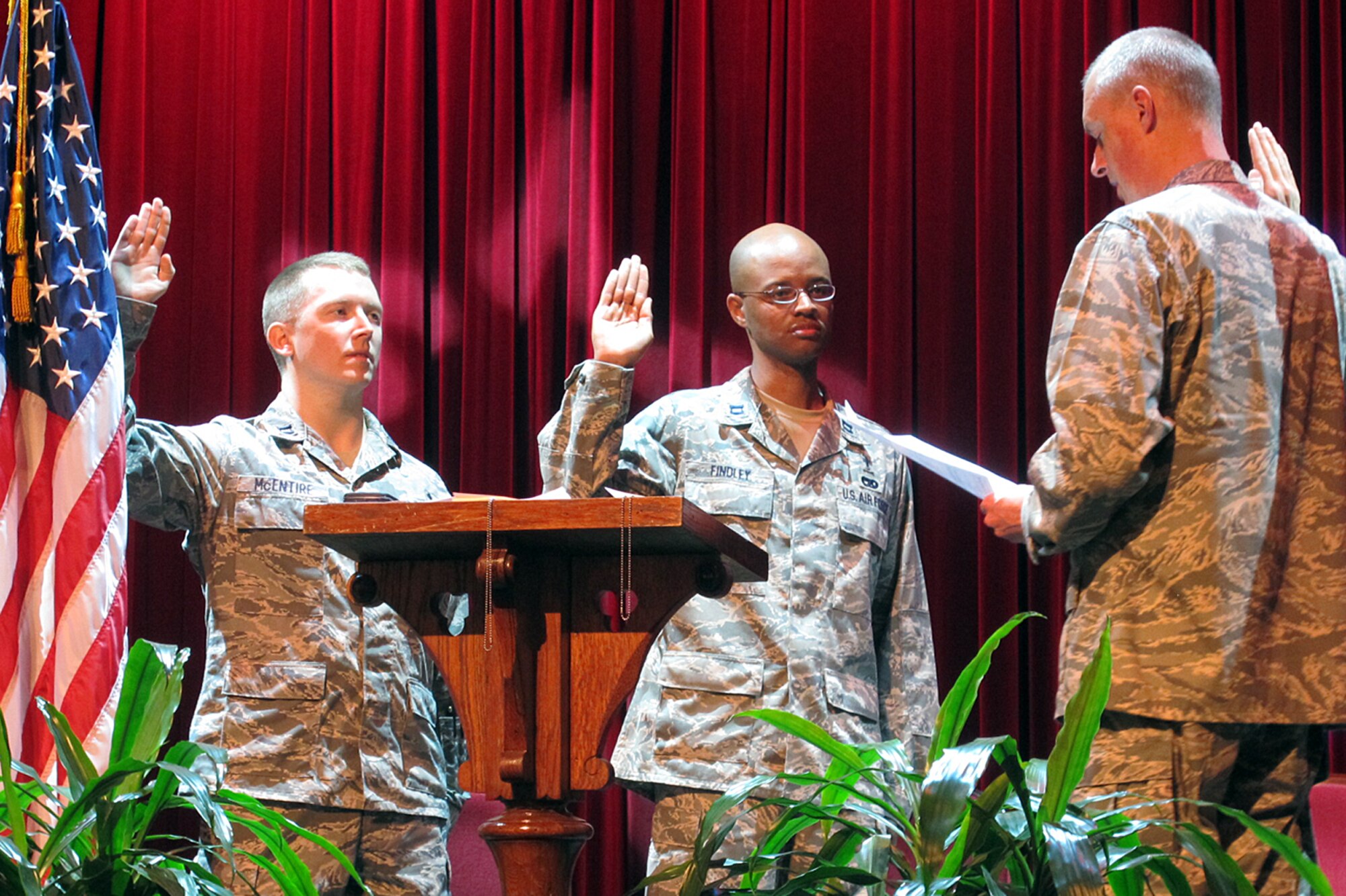 Chaplains, Capt. Benjamin McEntire (left) and Capt. Alan Findley administer their oath of office to Chaplain, Lt. Col. Brian Bohlman at the Newberry, S.C. Opera House,
Sept. 27, 2012. These are exciting times for the SCANG Chaplain's Office as their staff grows to care for the spiritual needs of the Swamp Fox flock.  (Courtesy photo by Joy Findley/Released)