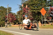Matt Knipen races on his bike during the cycling portion of the TriSumter triathlon, Sumter, S.C., Oct. 20, 2012.  15 Airmen from Shaw Air Force Base volunteered to help out with the event.  The event consisted of a 300 yard swim, a 16 mile bike ride and a 3.1 mile run.(U.S. Air Force photo by Airman Nicole Sikorski/Released)