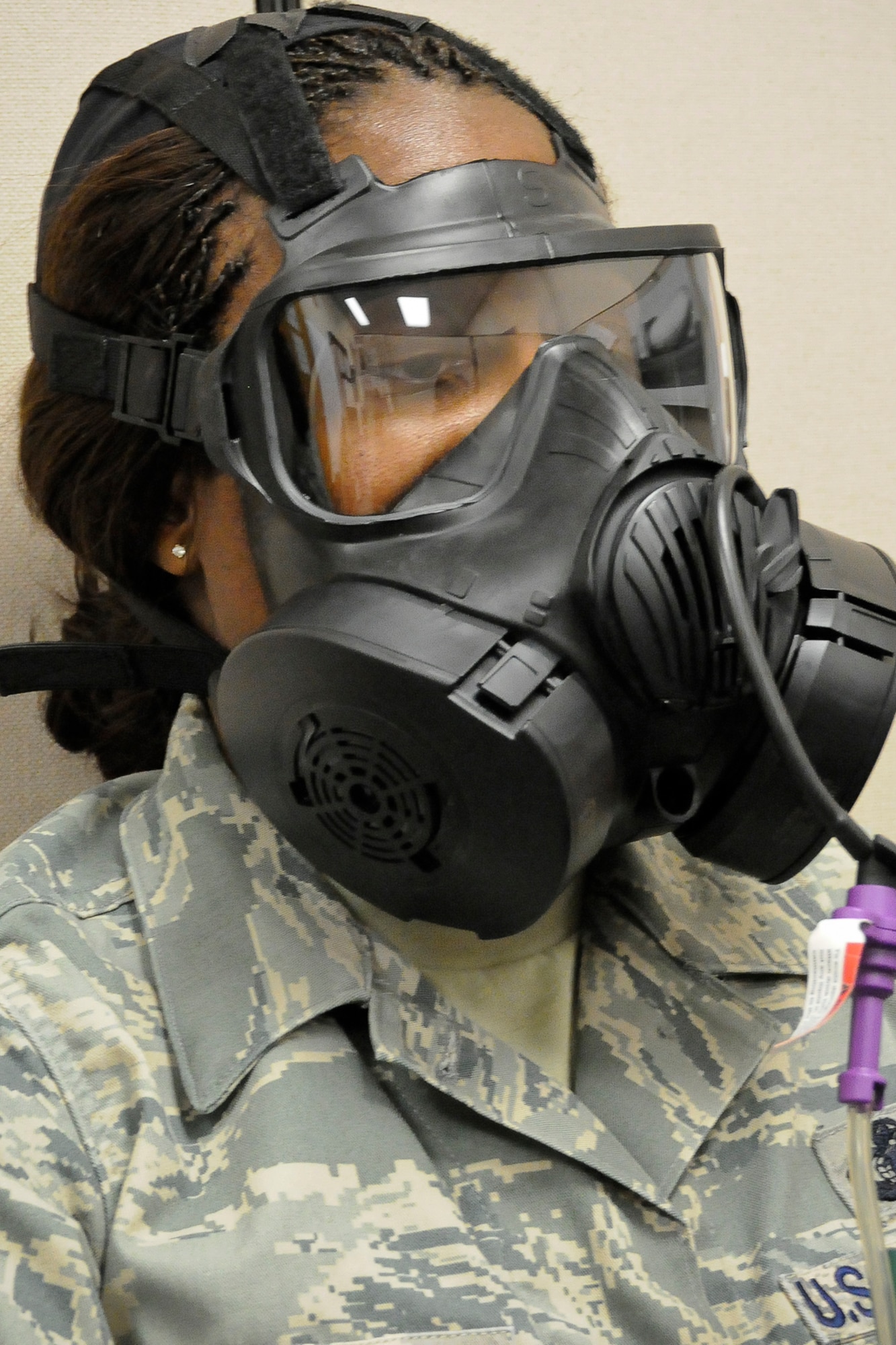 Master Sgt. Leslie Koger of the 245th Air Traffic Control Squadron, McEntire Joint National Guard Base, S.C., patiently completes her new M-50 gas mask "fit test", Oct. 18, 2012.  (National Guard photo by Master Sgt. Marvin R. Preston/Released)