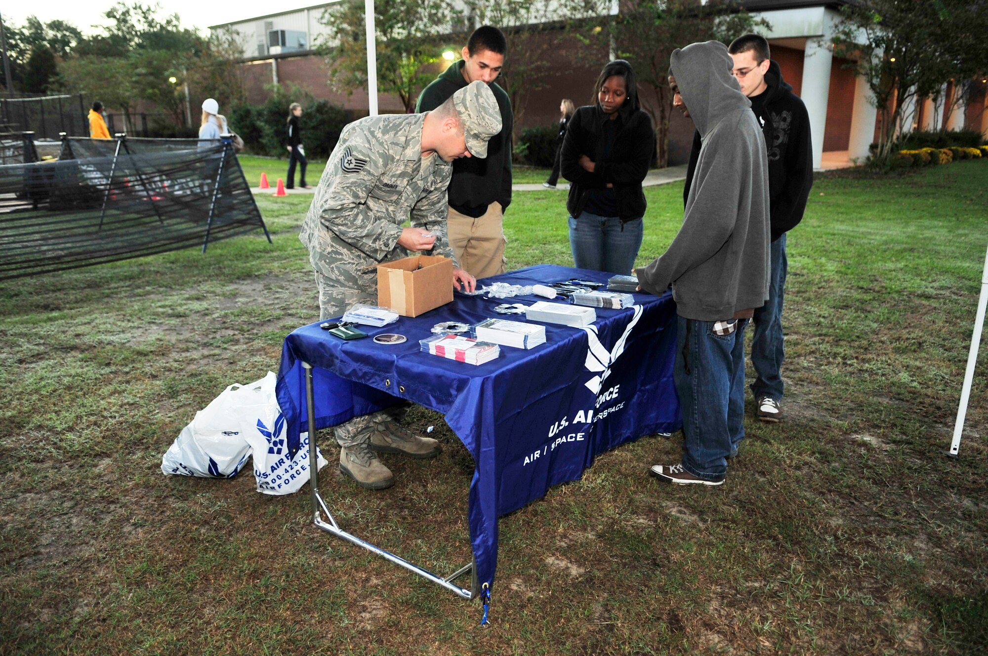 U.S. Air Force Tech. Sgt. Steven Dagnan, 337th recruiting squadron recruiter sets up a table with his Delayed Entry Program applicants at the TriSumter triathlon, Sumter, S.C., Oct. 20, 2012.  15 Airmen from Shaw Air Force Base volunteered to help out with the event.(U.S. Air Force photo by Airman Nicole Sikorski/Released)