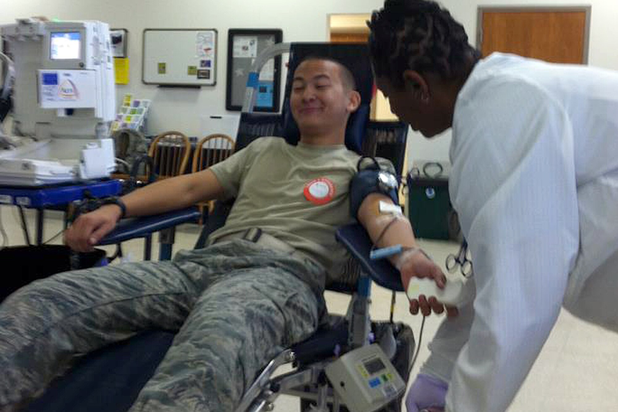 Airman 1st Class Alex Chang, a crew chief assigned to the 169th AMXS, donated blood to the American Red Cross, Oct.14. The blood drive held was held at the base
canteen in honor of Senior Master Sgt. Lisa Dinkins.  Dinkins' mother, Mary Ann, and daughter, Taylor were on hand at the blood drive as the Swamp Fox family came together to give 44 pints said Master Sgt. Selina Chavez, who organized the blood drive.  (National Guard photo by Tech. Sgt. Stephen Hudson/Released)