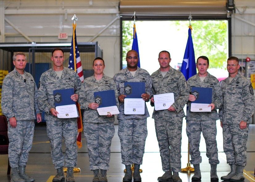Flanked by Lt. Gen. Eric Fiel, commander of Air Force Special Operations Command, left, and Chief Master Sgt. William Turner, AFSOC‘s command chief, five of the 919th Special Operations Wing’s newest Promotion Enhancement Program promotees display their certificates Oct. 14 at Duke Field, Fla.  From left are Senior Master Sgts. Steve Bicknell, Angelia Fogle and Derrick Richardson, and Master Sgts. Christiaan Becker and Charles Presley.  Not shown:  Chief Master Sgt. Darlene Peterson and Master Sgt. Greg Lobman.  The PEP is a commander’s program designed to promote outstanding and well-deserving enlisted reservists who clearly demonstrate the ability to serve in the next higher grade.  (U.S. Air Force photo/Tech. Sgt. Cheryl Foster) 