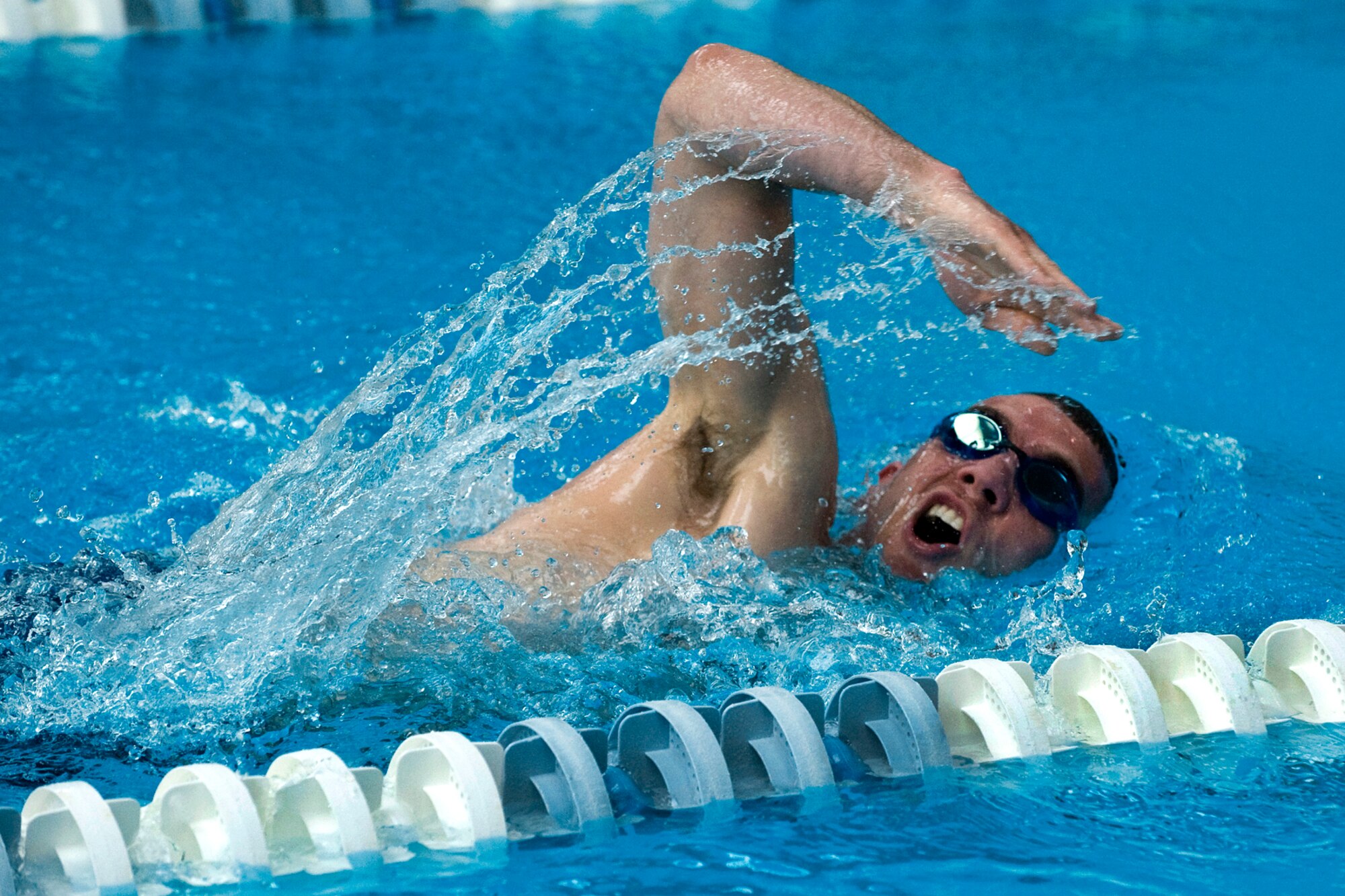 PETERSON AIR FORCE BASE, Colo. – Navy Lt. Shawn Callahan, NORAD/NORTHCOM, powers through the water at the Peterson sports and field day Oct. 12. The 21st Force Support Squadron arranged various sporting events around base including golf, poker, swimming, running, cycling, volleyball and more, along with a free lunch at Eagle Park complete with entertainment and vendors. Winners included: Small group – 544th Intelligence, Surveillance and Reconnaissance Group; Medium group – AFSPC Inspector General; Large group – Team Colorado. (U.S Air Force photo/Craig Denton)