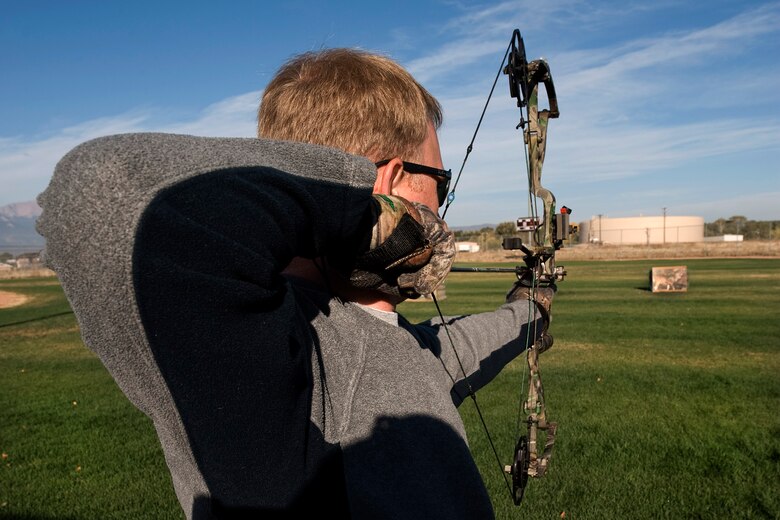 PETERSON AIR FORCE BASE, Colo. -- Tech. Sgt. Dan Sherer, NORAD/J3, carefully aims his bow at an elk target 30 yards away at the Peterson sports and field day Oct. 12. The 21st Force Support Squadron arranged various sporting events around base including golf, poker, swimming, running, cycling, volleyball and more, along with a free lunch at Eagle Park complete with entertainment and vendors. Winners included: Small group – 544th Intelligence, Surveillance and Reconnaissance Group; Medium group – AFSPC Inspector General; Large group – Team Colorado. (U.S Air Force photo/Craig Denton)