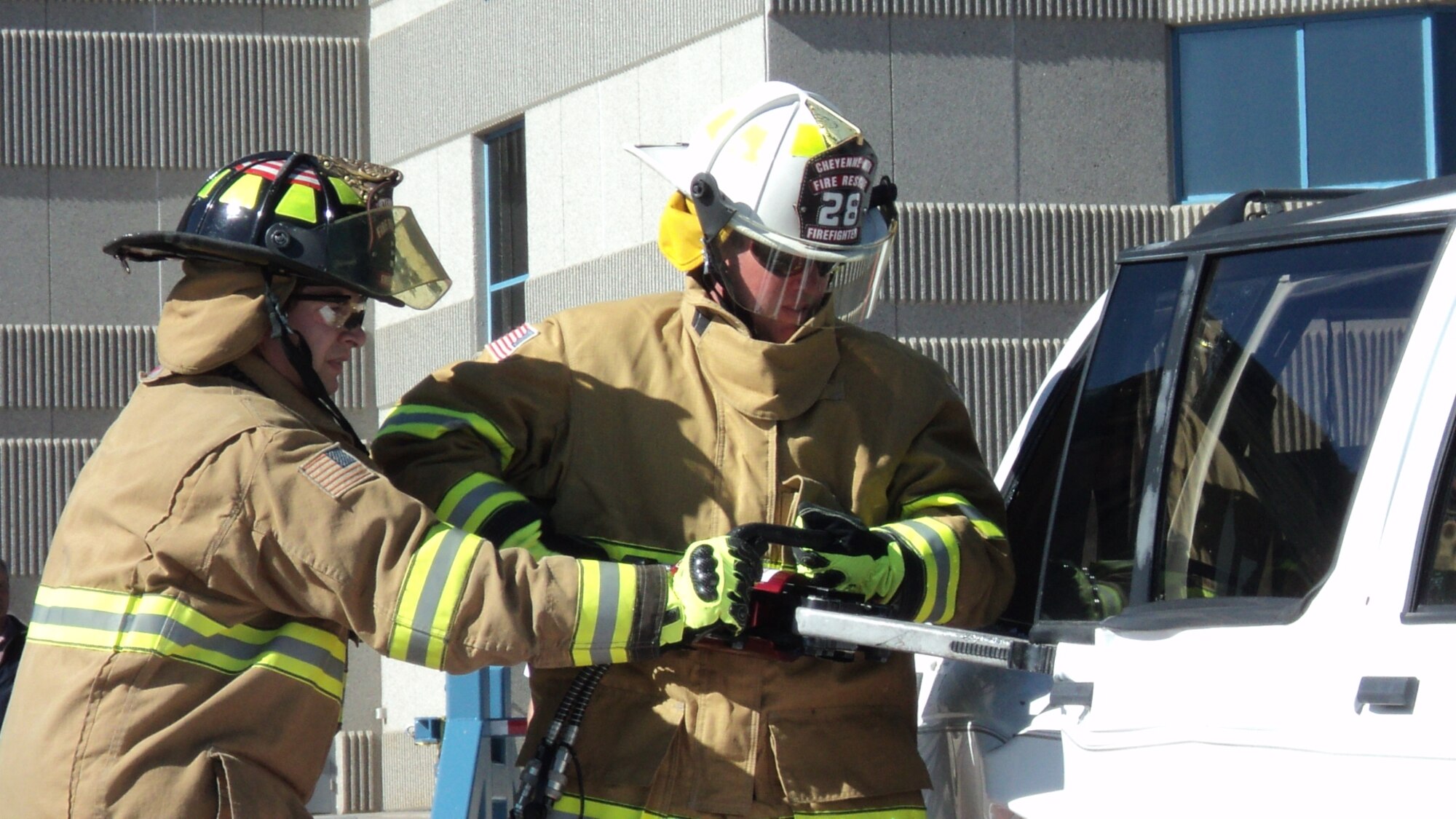 CHEYENNE MOUNTAIN AIR FORCE STATION, Colo. -- Members of the 721st Civil Engineer Squadron fire and emergency services demonstrate a vehicle extrication Oct. 9, 2012. The activity was part of the 2012 Fire Prevention Week activities. This year’s theme was “Have 2 Ways Out.” (U.S. Air Force photo/Vincent Ferrell) 