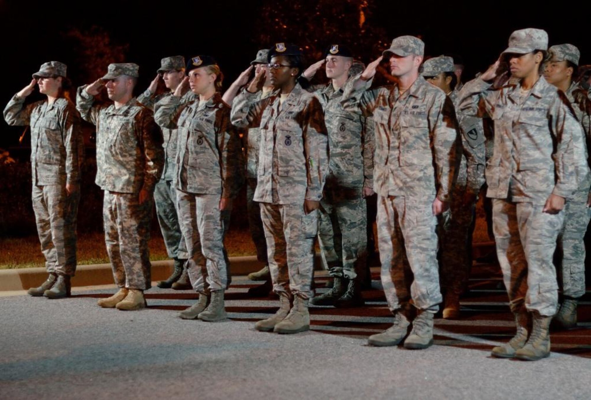 Military members of the 45th Space Wing, and our mission partners, render salutes to the WWII Vets being honored. 

