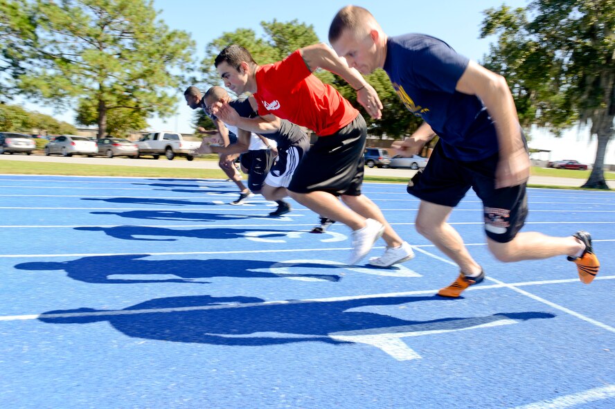 Runners take off at the start of the 100-meter final during Super Sports Day at Moody Air Force Base, Ga., Oct. 19, 2012. Throughout the day Moody Airmen participated in multiple sporting events for points and bragging rights for their organizations. (U.S. Air Force photo by Staff Sgt. Joshua J. Garcia/Released)