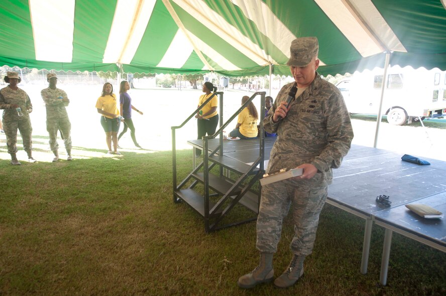 U.S. Air Force Col. Jeffery Decker, 23d Maintenance Group commander, gives final remarks to wrap up Super Sports Day at Moody Air Force Base, Ga., Oct. 19, 2012. Decker thanked volunteers, staff and everyone for coming out for the event and wished everyone a safe weekend. (U.S. Air Force photo by Airman 1st Class Paul Francis/Released)
