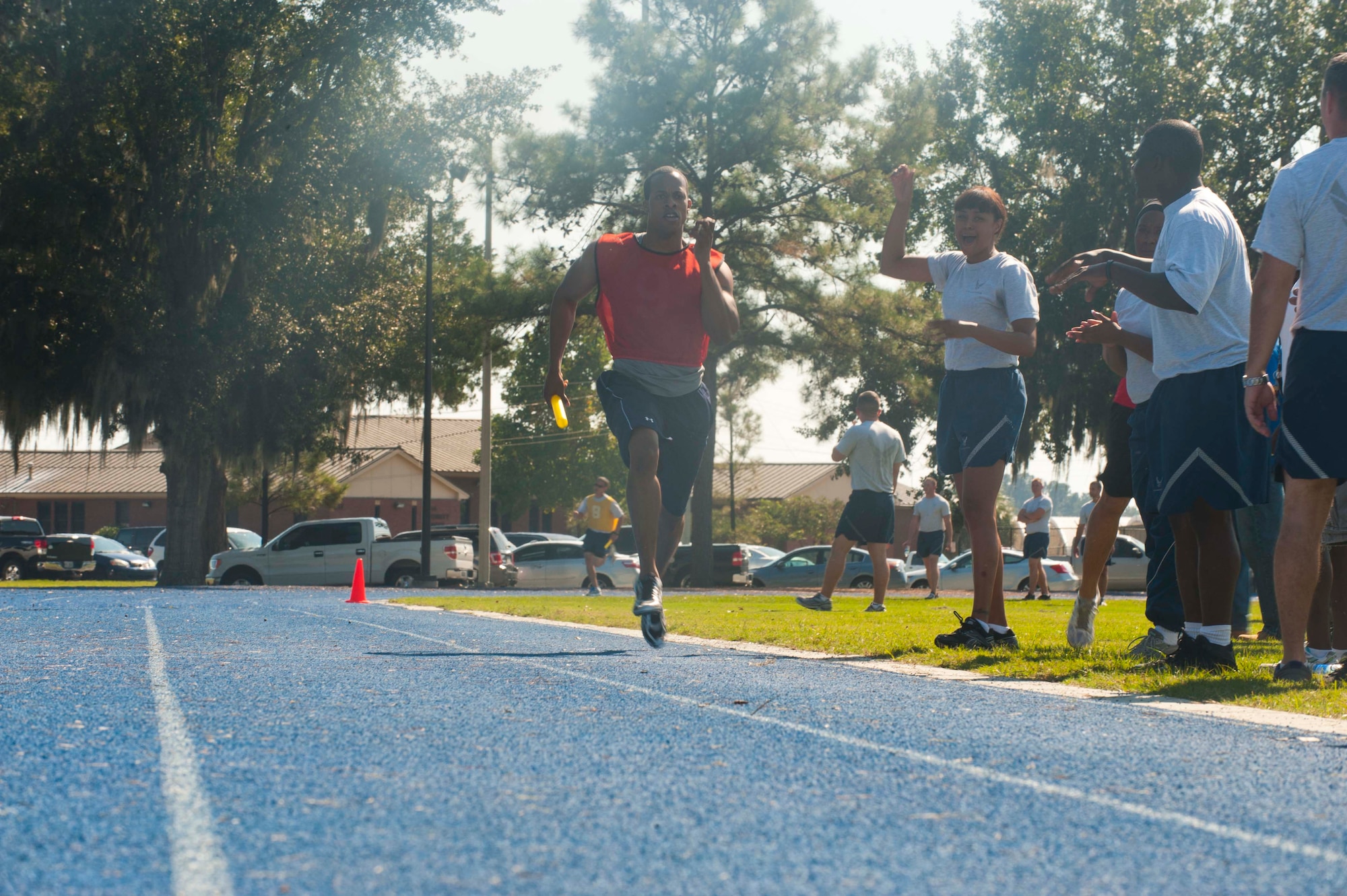 Christopher Brown, 23d Communications Squadron, sprints down the final leg of the 4x400 during Super Sports Day at Moody Air Force Base, Ga., Oct. 19, 2012. Each team had four members who ran one lap, passing the baton until all members finished. (U.S. Air Force photo by Airman 1st Class Paul Francis/Released)
