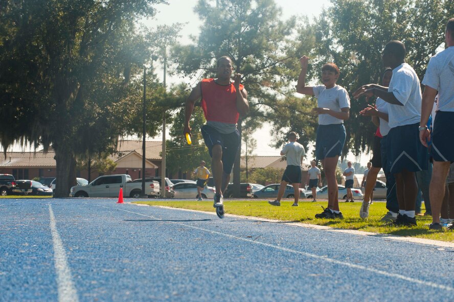 Christopher Brown, 23d Communications Squadron, sprints down the final leg of the 4x400 during Super Sports Day at Moody Air Force Base, Ga., Oct. 19, 2012. Each team had four members who ran one lap, passing the baton until all members finished. (U.S. Air Force photo by Airman 1st Class Paul Francis/Released)
