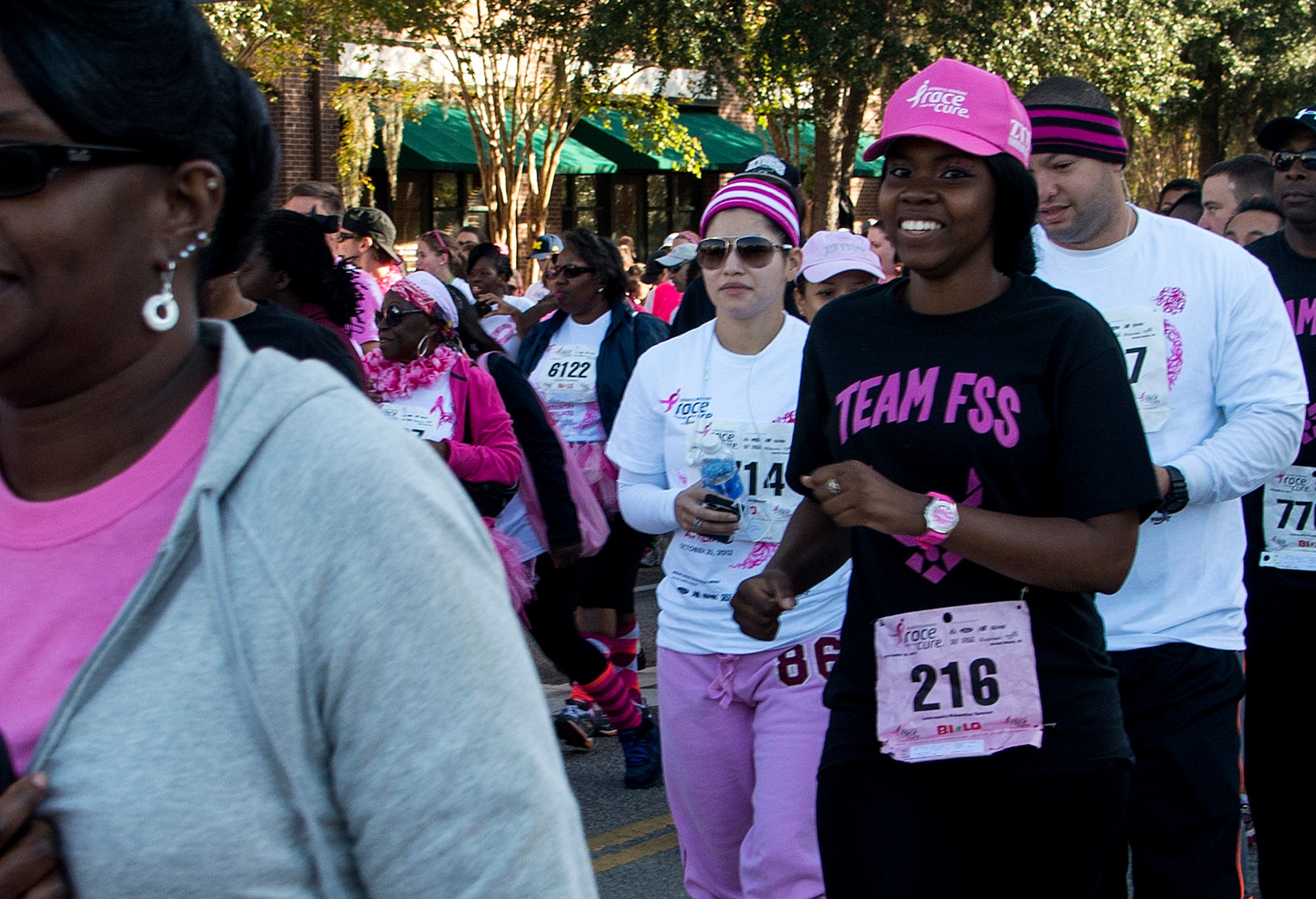 Senior Airman Latisha Chong, breast cancer survivor,, from the 628th Force Support Squadron, runs in the Susan G. Komen Race for the Cure in Charleston, S.C., Oct. 20, 2012.  She was diagnosed with breast cancer Jan. 19, 2012 and was told she was cancer free June 19, 2012.  FSS put together a team of more than 50 runners with the goal of raising $1,000 in donations. The team not only met the $1,000 goal, they exceeded it by more than $700 with donations of $1,700.   (U.S. Air Force/Staff Sgt. Rasheen Douglas)
