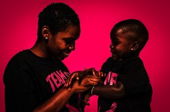 Senior Airman Latisha Chong, 628th Force Support Squadron, plays with her son Malachi, Oct. 16, 2012 at Joint Base Charleston - Air Base, S.C. Chong was diagnosed with breast cancer Jan. 19, 2012. Chong went through chemotherapy for five months and was told she was cancer free June 19, 2012. (U.S. Air Force illustration/ Airman 1st Class Chacarra Walker)