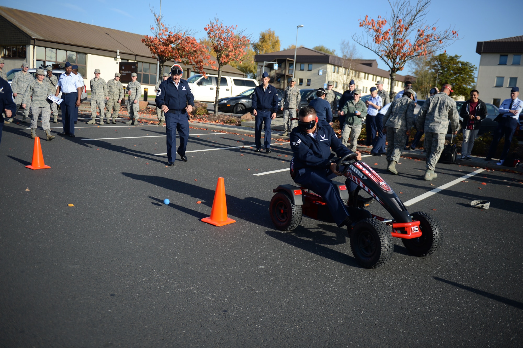 SPANGDAHLEM AIR BASE, Germany – U.S. Air Force Senior Airman Adam Burkhardt, 52nd Communications Squadron knowledge operations manager from Houston, drives a go-kart while wearing drunk-goggles outside the Spangdahlem Skyline Movie Theater during a “Drunk Busters” obstacle course event Oct. 22, 2012.  Drunk-goggles simulate the effects of alcohol impairment including reduced alertness, slowed reaction time, visual distortion, alteration of depth and distance perception, double vision and lack of muscular coordination. (U.S. Air Force photo by Airman 1st Class Gustavo Castillo/Released)